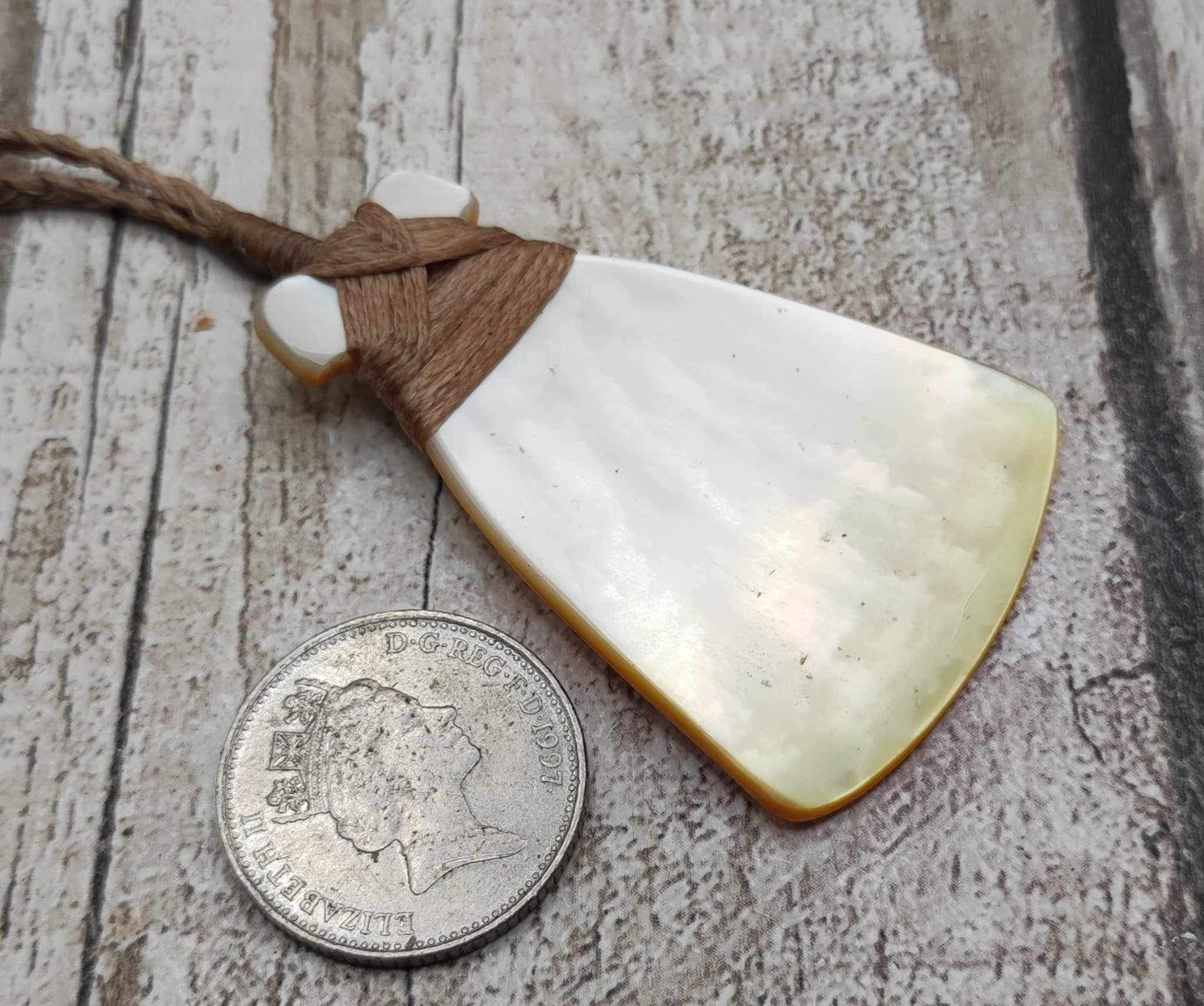 Mother of Pearl Hei Toki adze pendant.