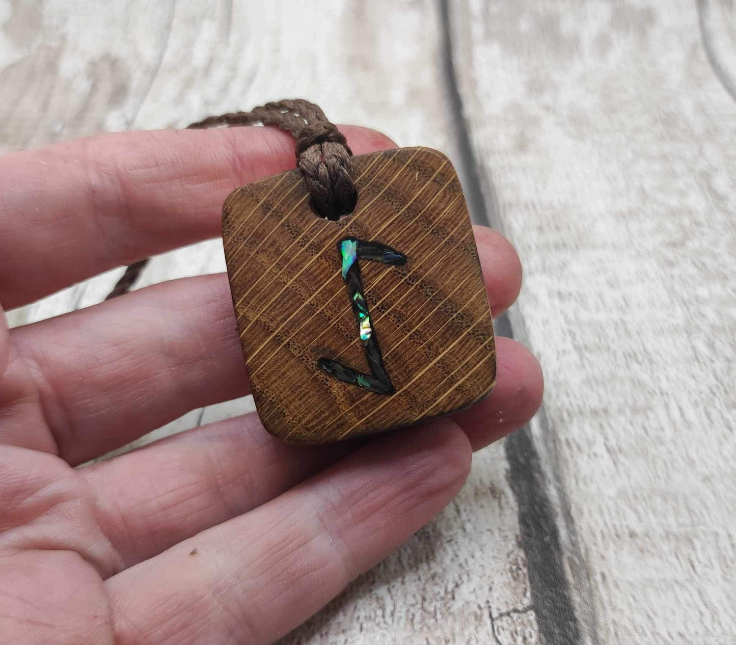 Eihwaz oak wood rune pendant with Pāua shell inlay.