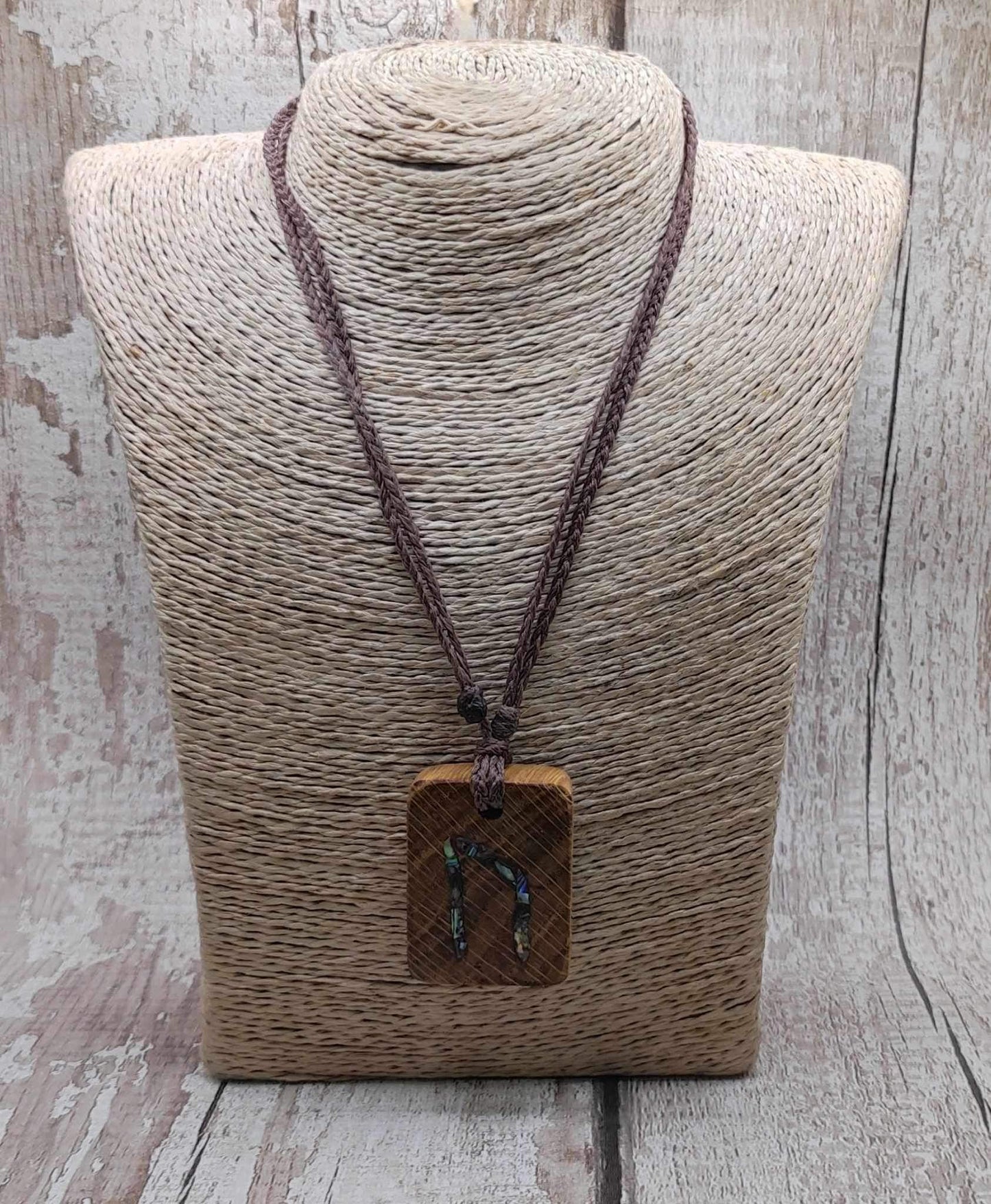 Oak wood Uruz rune pendant with Pāua shell.