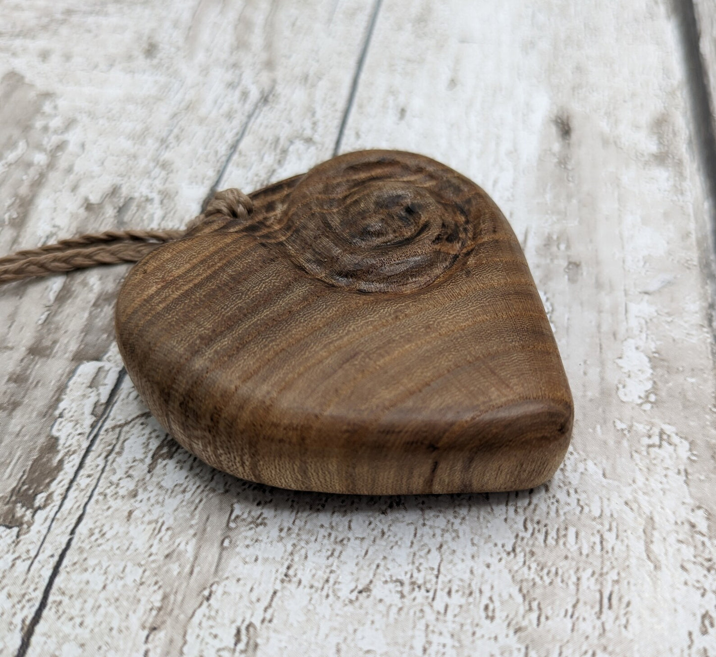 Birch wood Koru heart carved pendant.