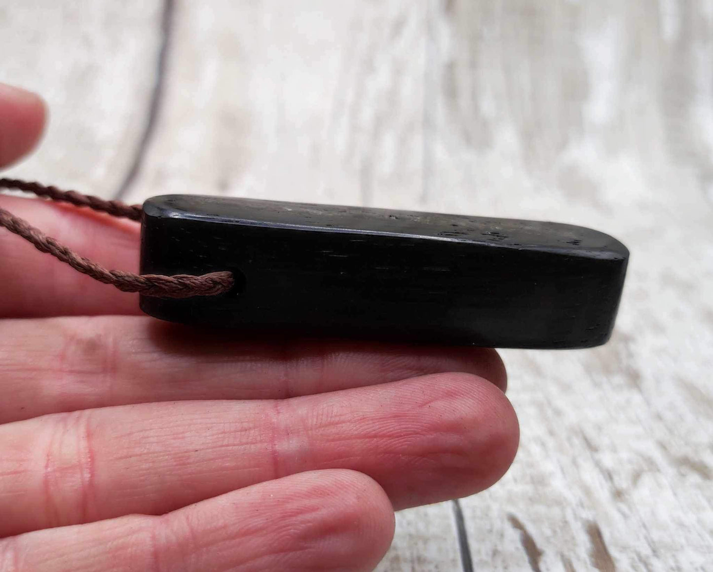 Bog oak and moldavite glass,