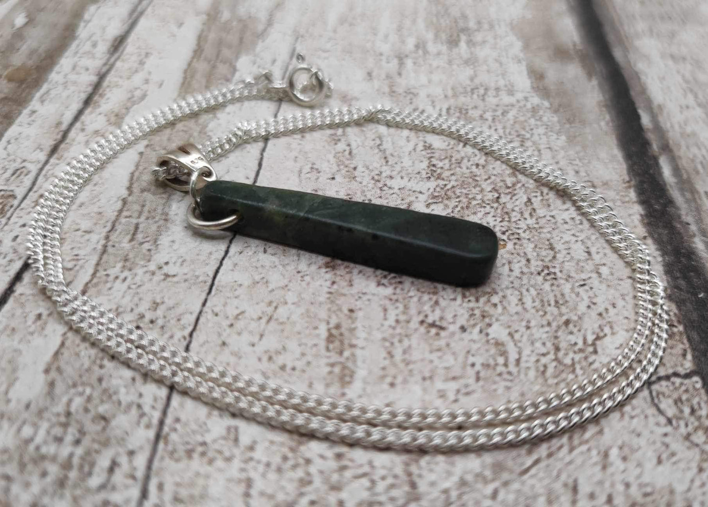 New Zealand Pounamu Greenstone serpentine, roimata drop on silver pendant.