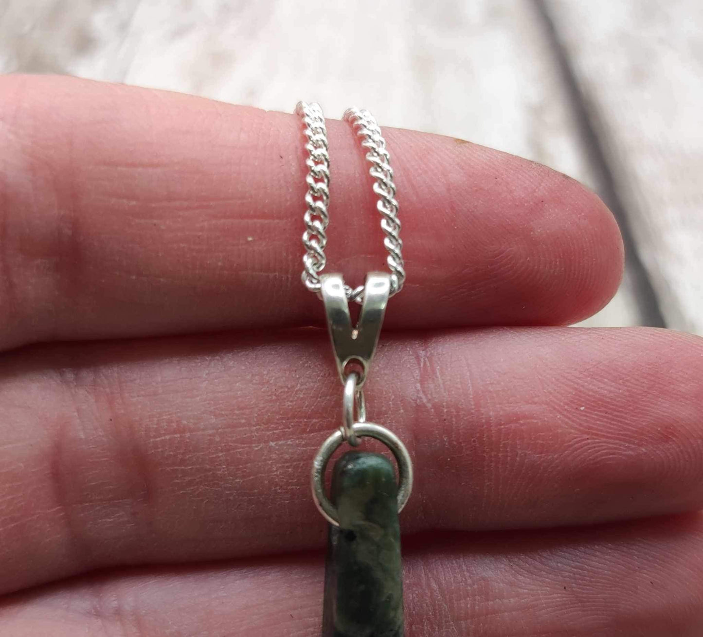 New Zealand Pounamu Greenstone serpentine, roimata drop on silver pendant.