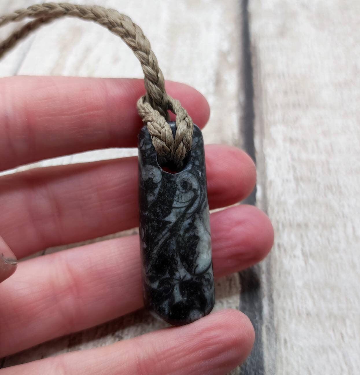 Goniatite ammonite and orthoseras bedrock roimata pendant.