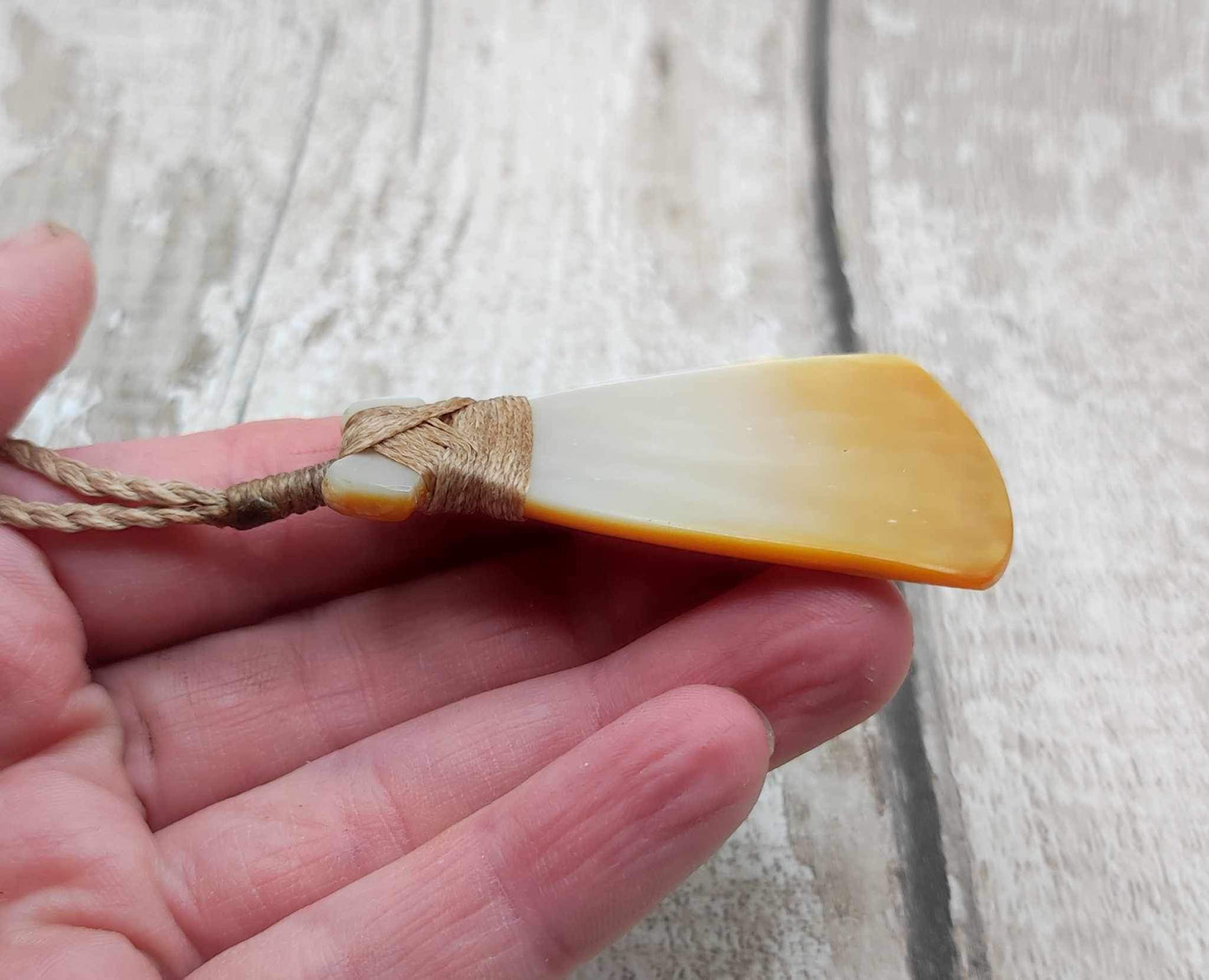 Mother of Pearl Hei Toki adze pendant.