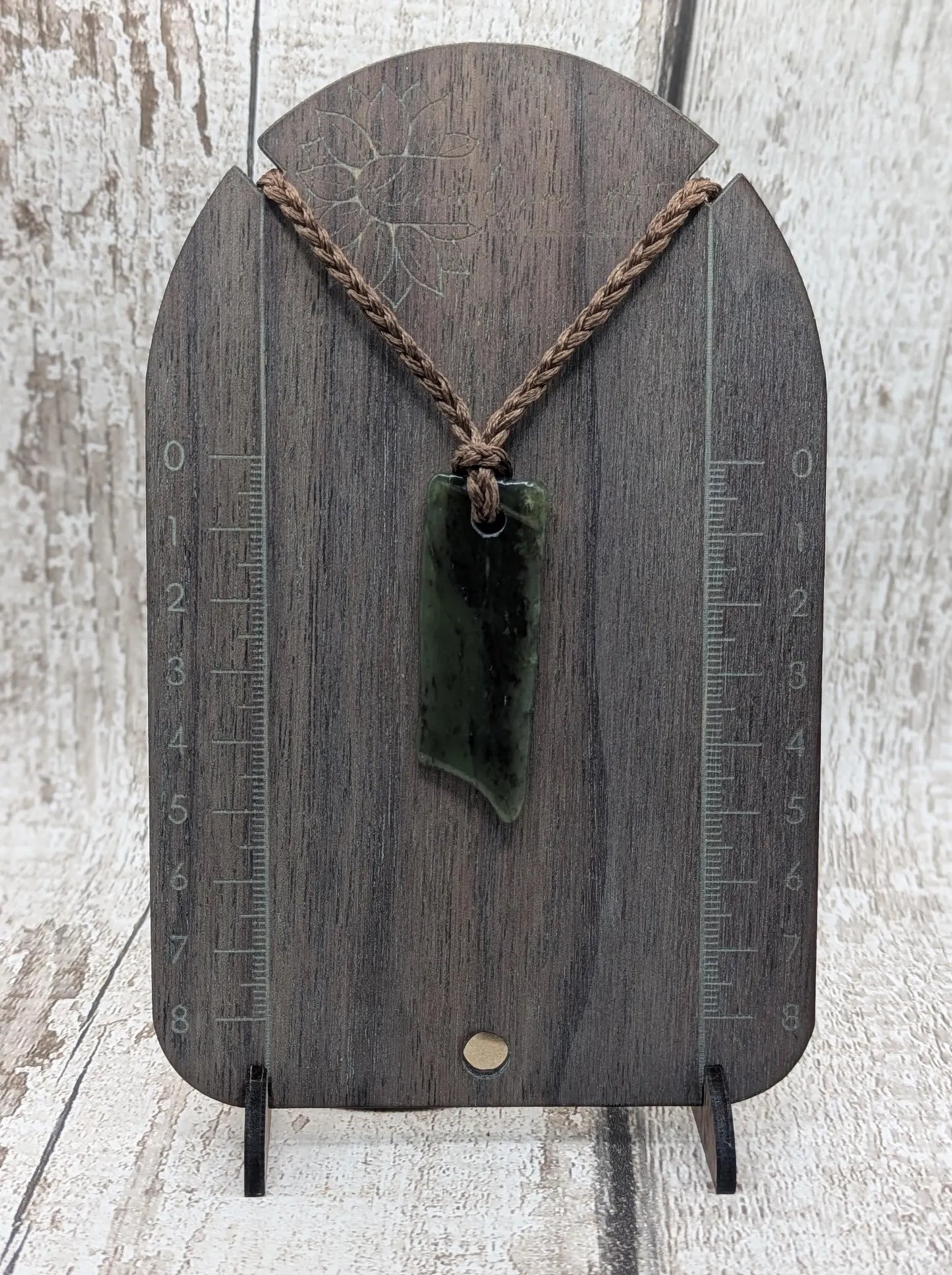 Tumbled Pounamu nephrite jade pendant.