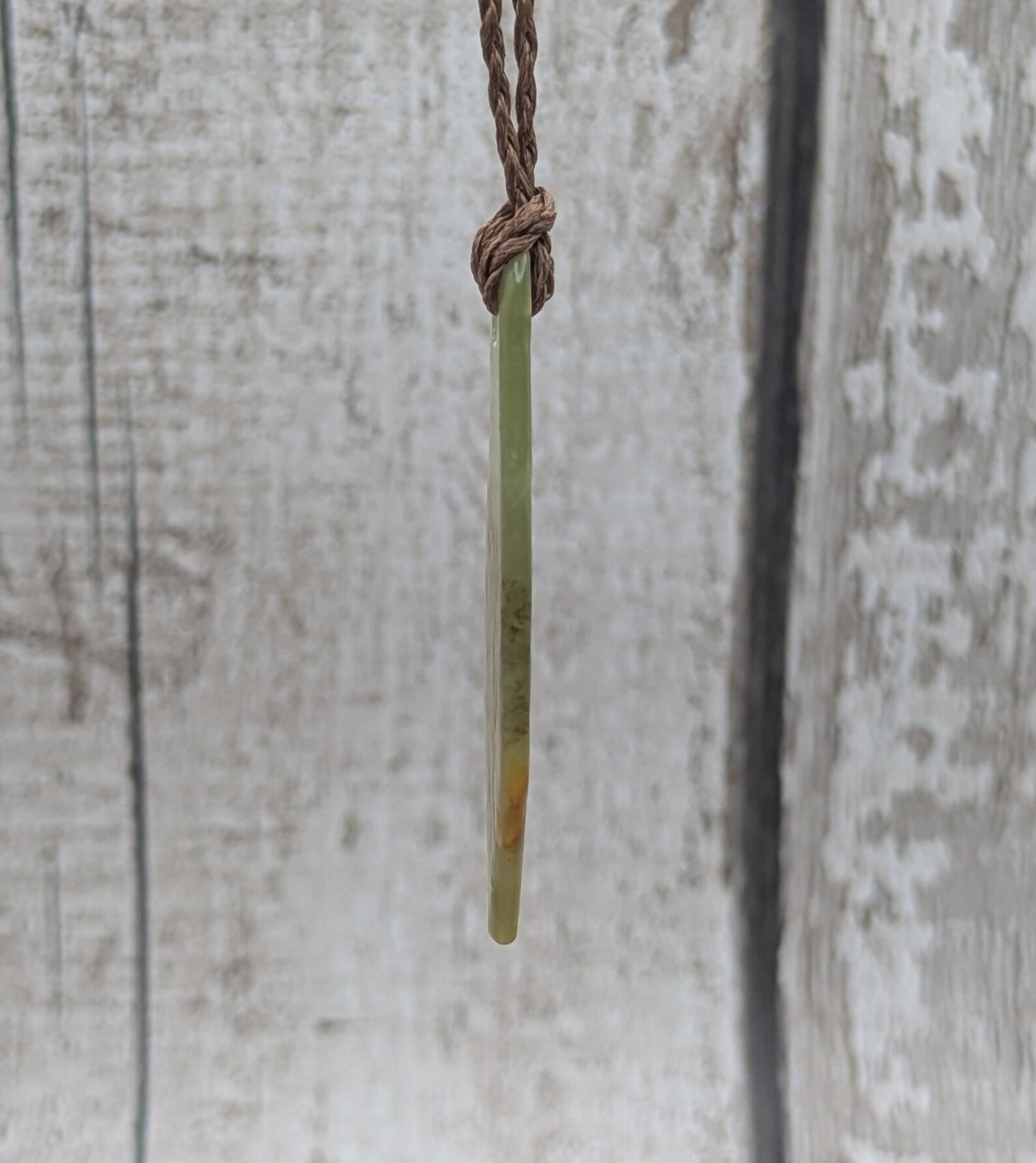 One random Pounamu nephrite jade pendant.