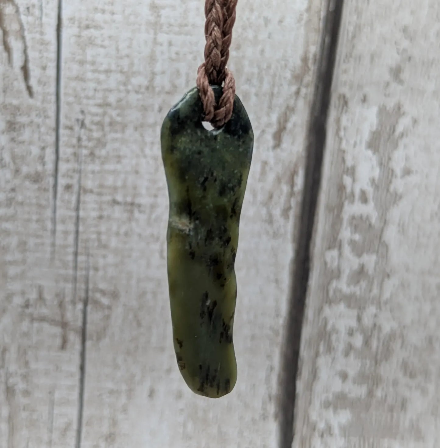 New Zealand Pounamu greenstone tumbled pendant.