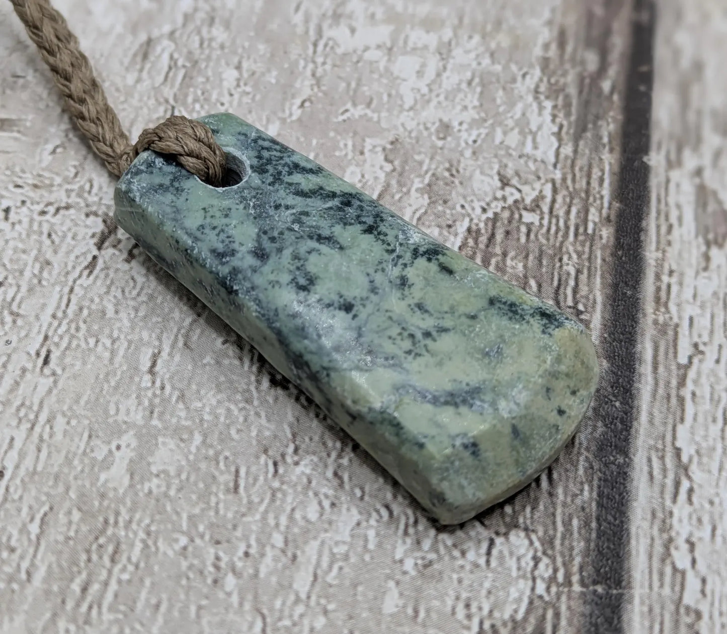 New Zealand pounamu greenstone jade hei toki adze pendant.