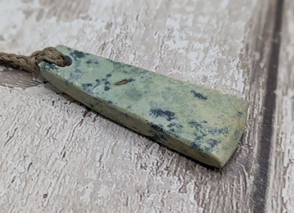 New Zealand pounamu greenstone jade raw back pendant.