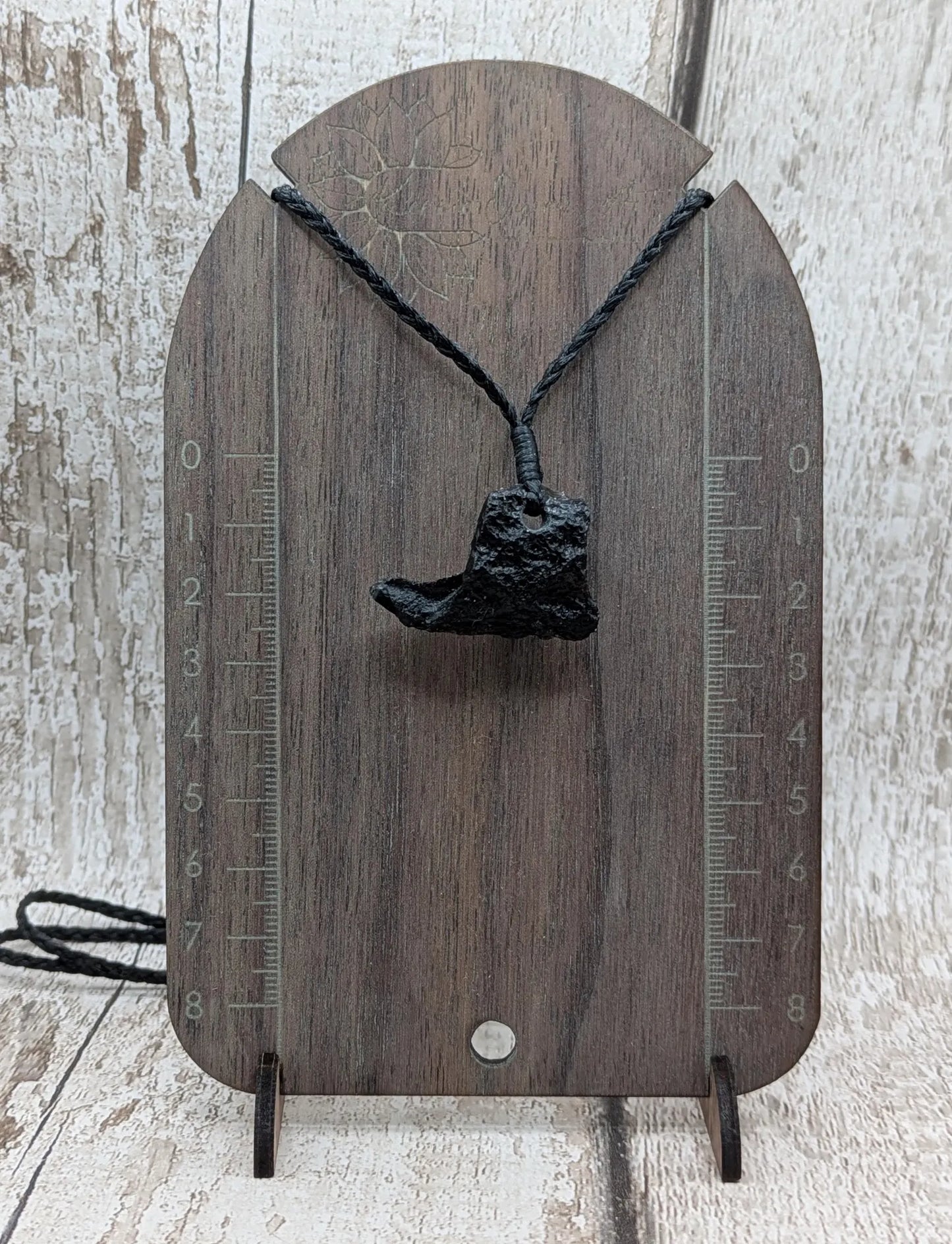 One Indonesian meteorite tektite impact glass pendant.