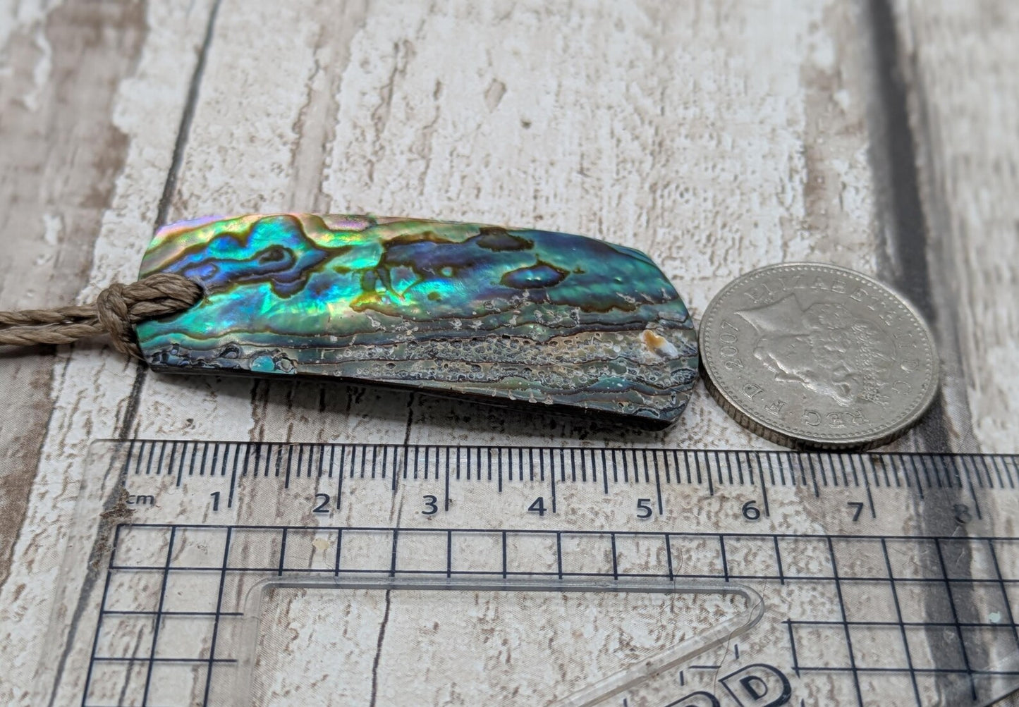 New Zealand Rainbow pāua shell pendant - iridescent abalone necklace, trapezoid shape, oceanic gift, hand crafted jewellery.