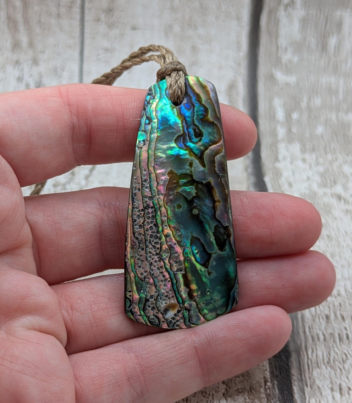 New Zealand Rainbow pāua shell pendant - iridescent abalone necklace, trapezoid shape, oceanic gift, hand crafted jewellery.