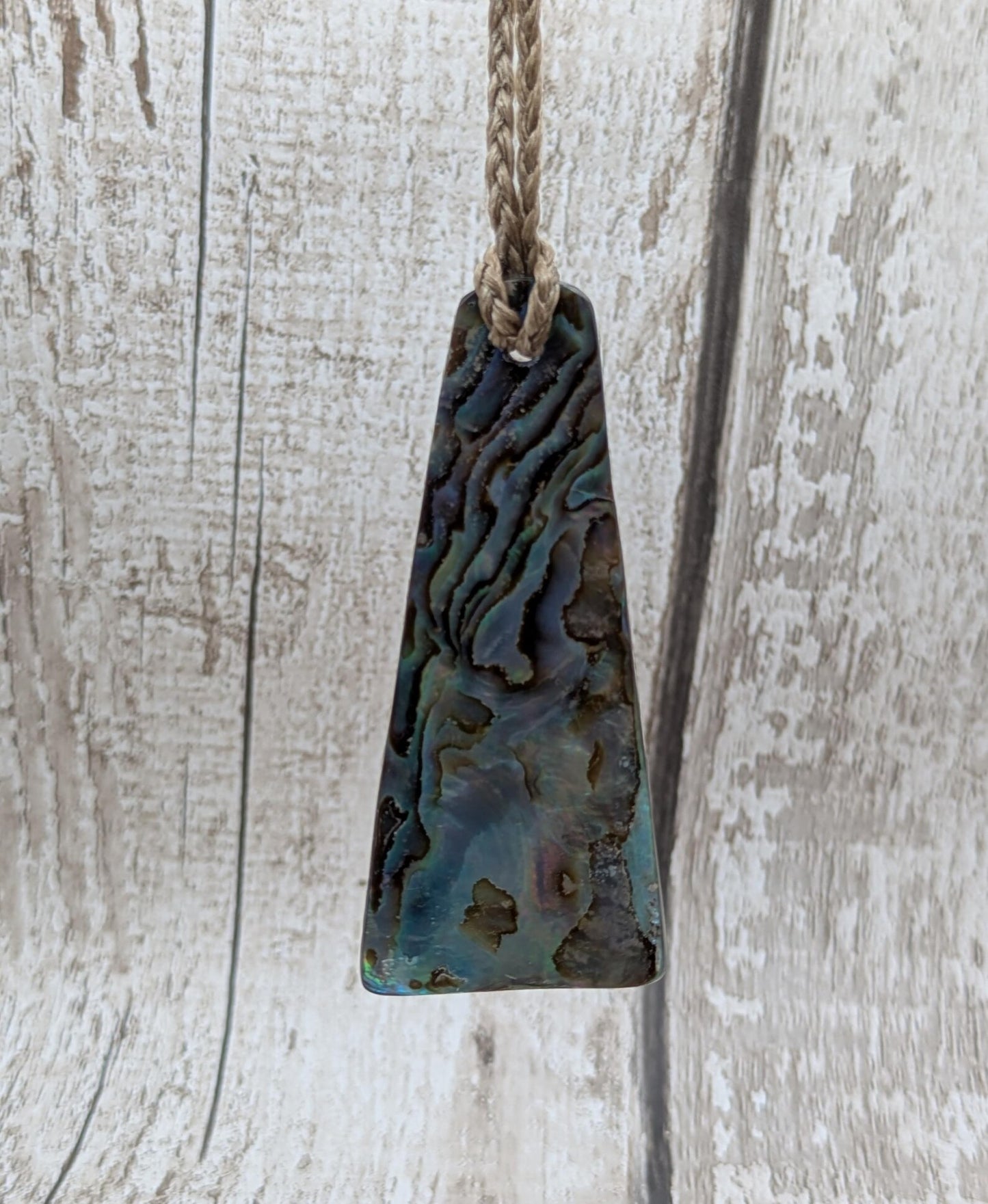 New Zealand Rainbow pāua shell pendant - iridescent abalone necklace, trapezoid shape, oceanic gift, hand crafted jewellery.