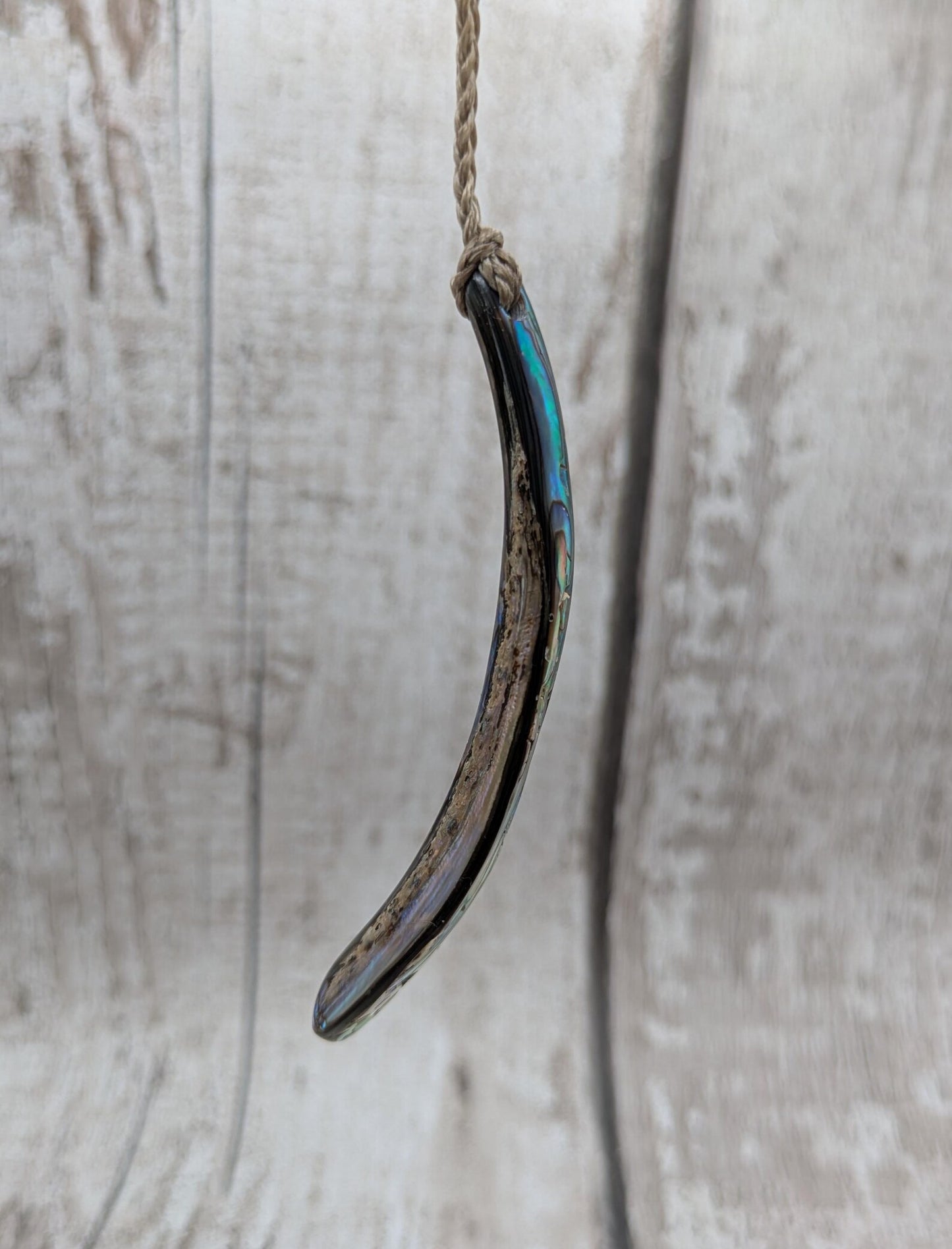 New Zealand rainbow pāua rim drop pendant.