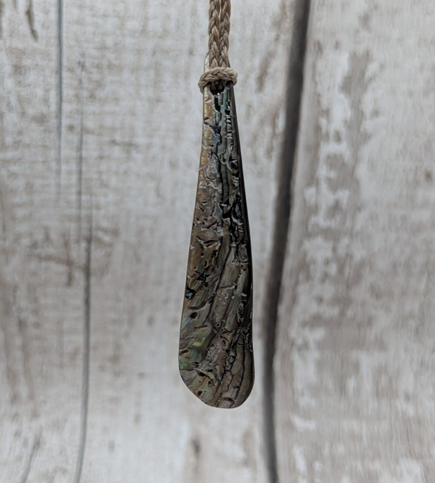New Zealand rainbow pāua rim drop pendant.