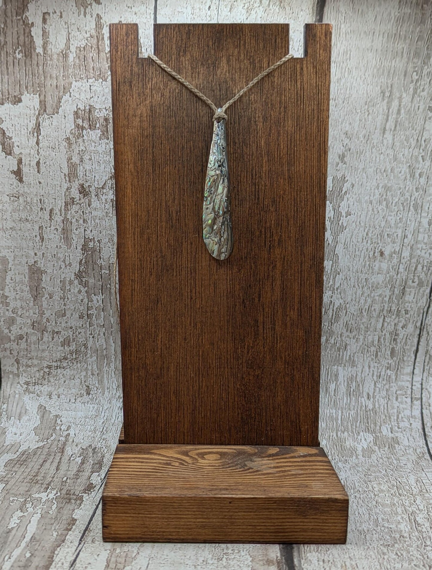 New Zealand rainbow pāua rim drop pendant.