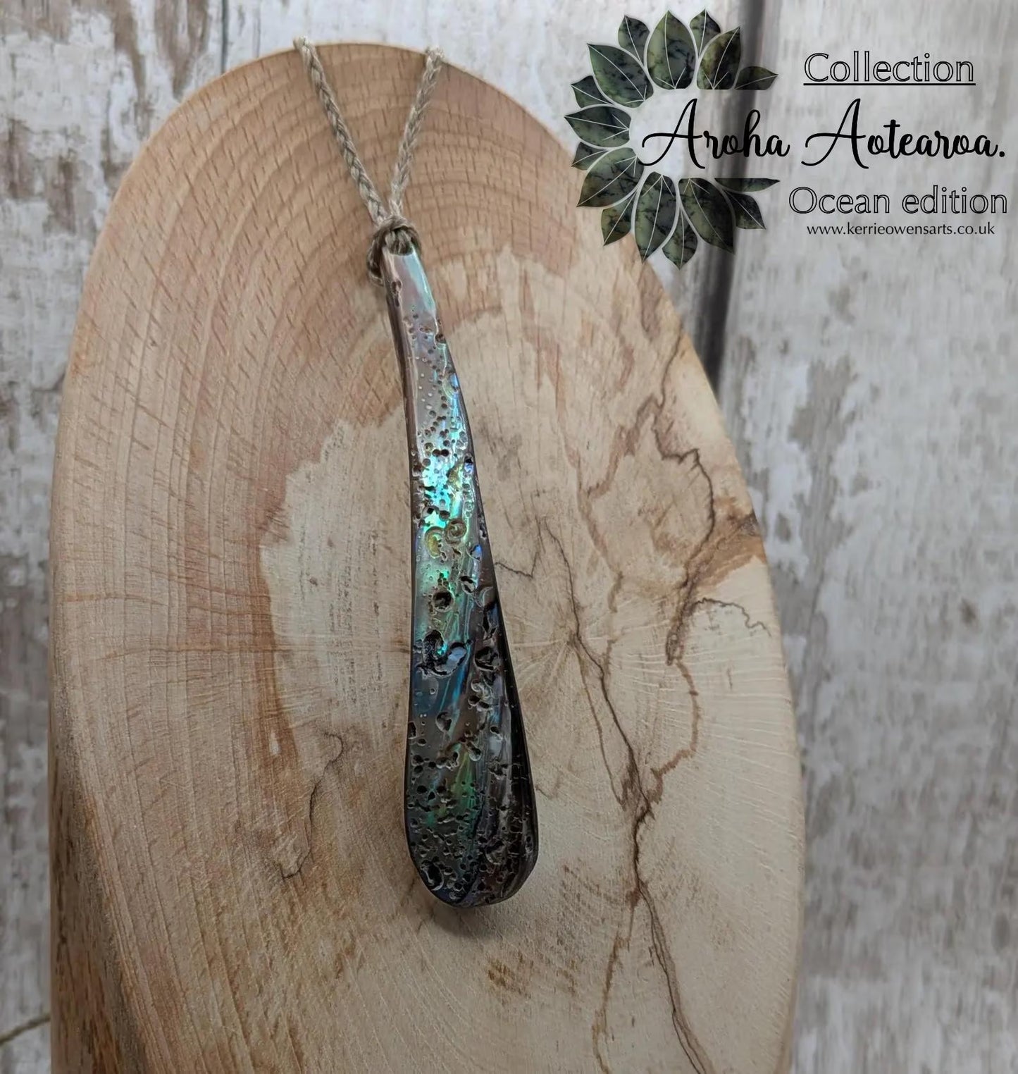 New Zealand rainbow pāua rim drop pendant.
