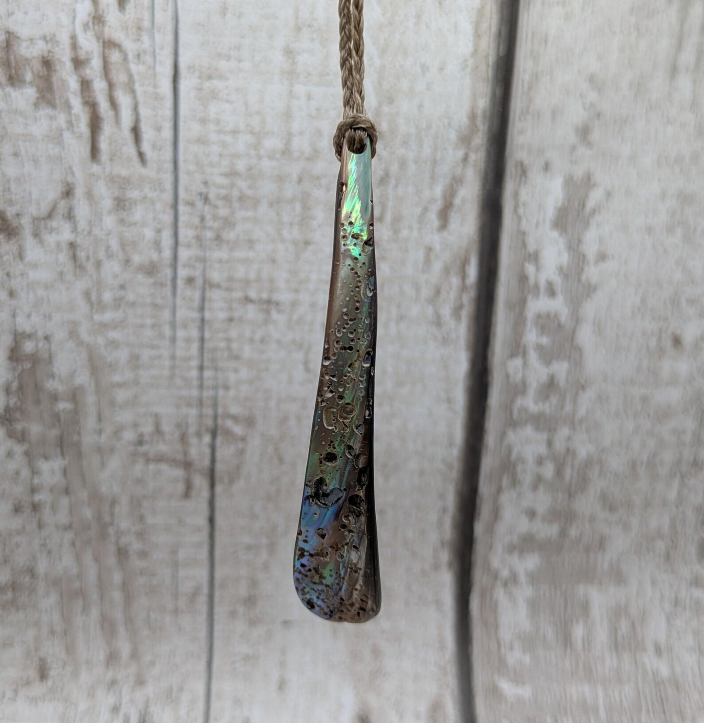 New Zealand rainbow pāua rim drop pendant.