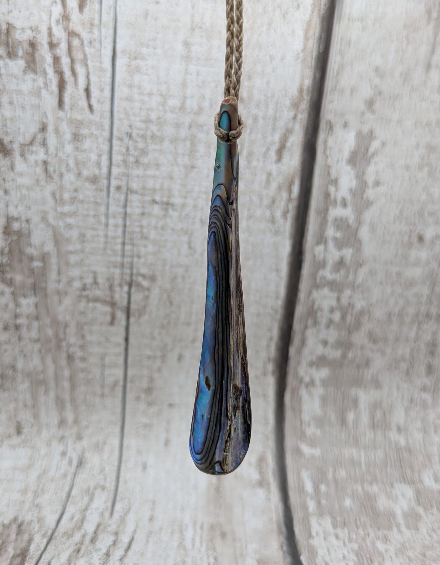 New Zealand rainbow pāua rim drop pendant.