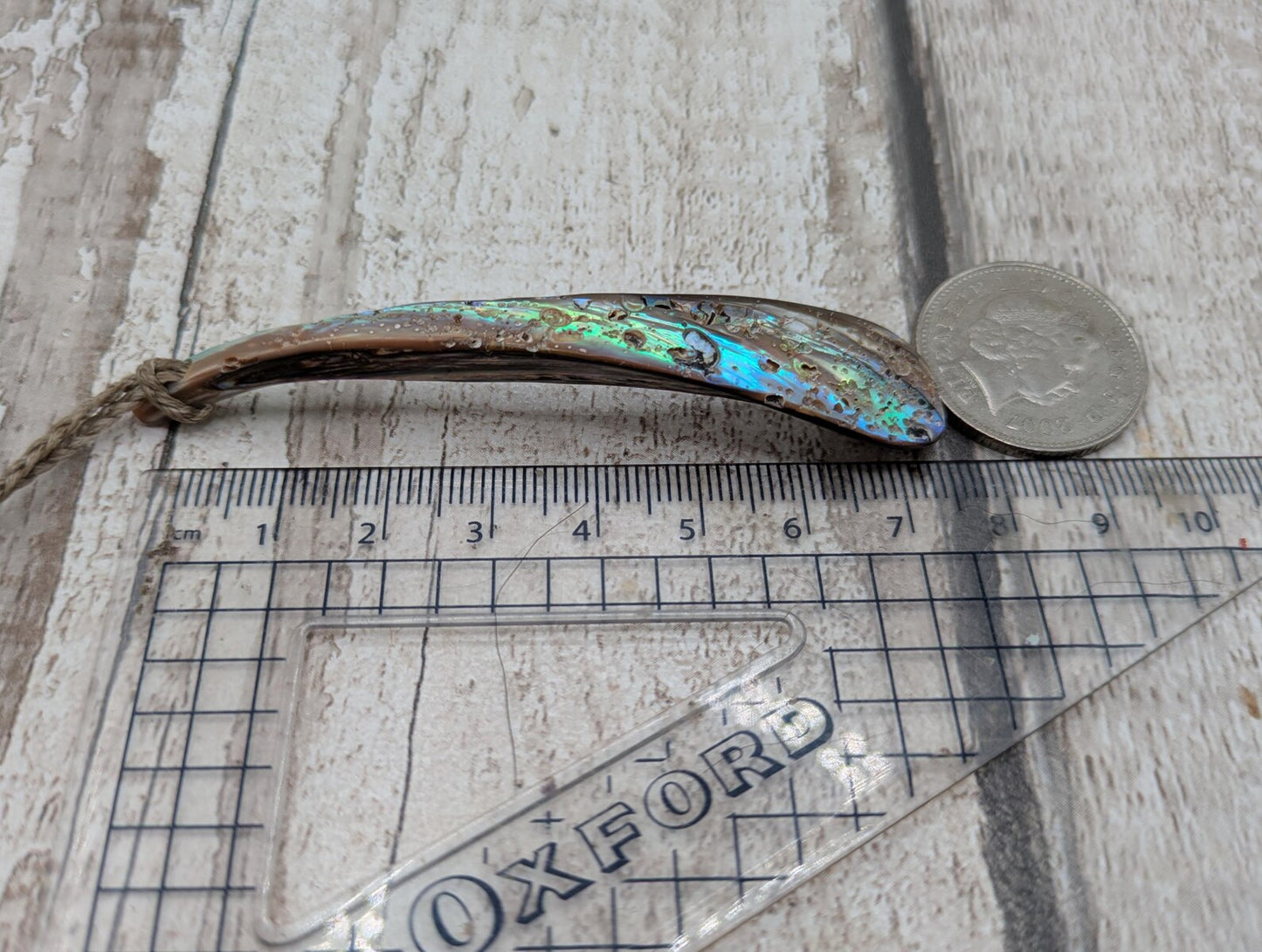 New Zealand rainbow pāua rim drop pendant.