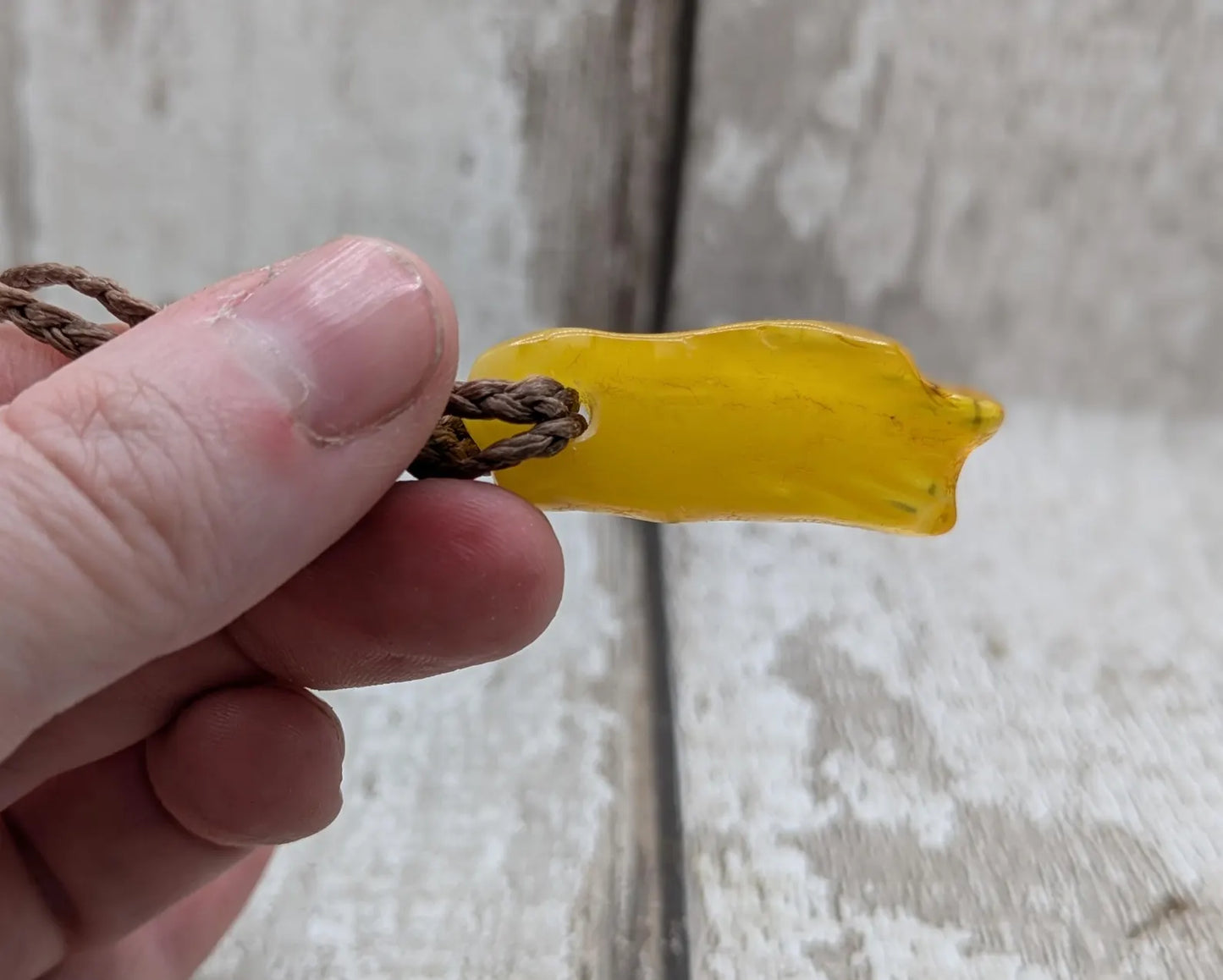 Tumble polished baltic amber pendant.