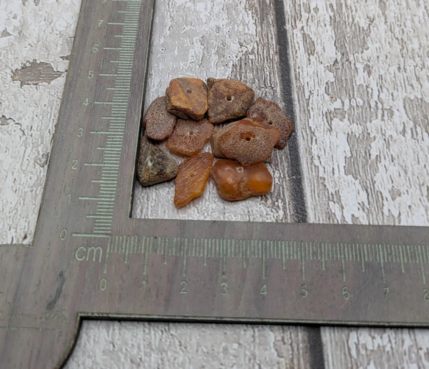10 Raw natural centre drilled Baltic Amber beads.