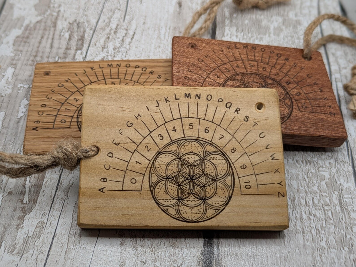 Tulip wood pendulum board with geometric laser print.