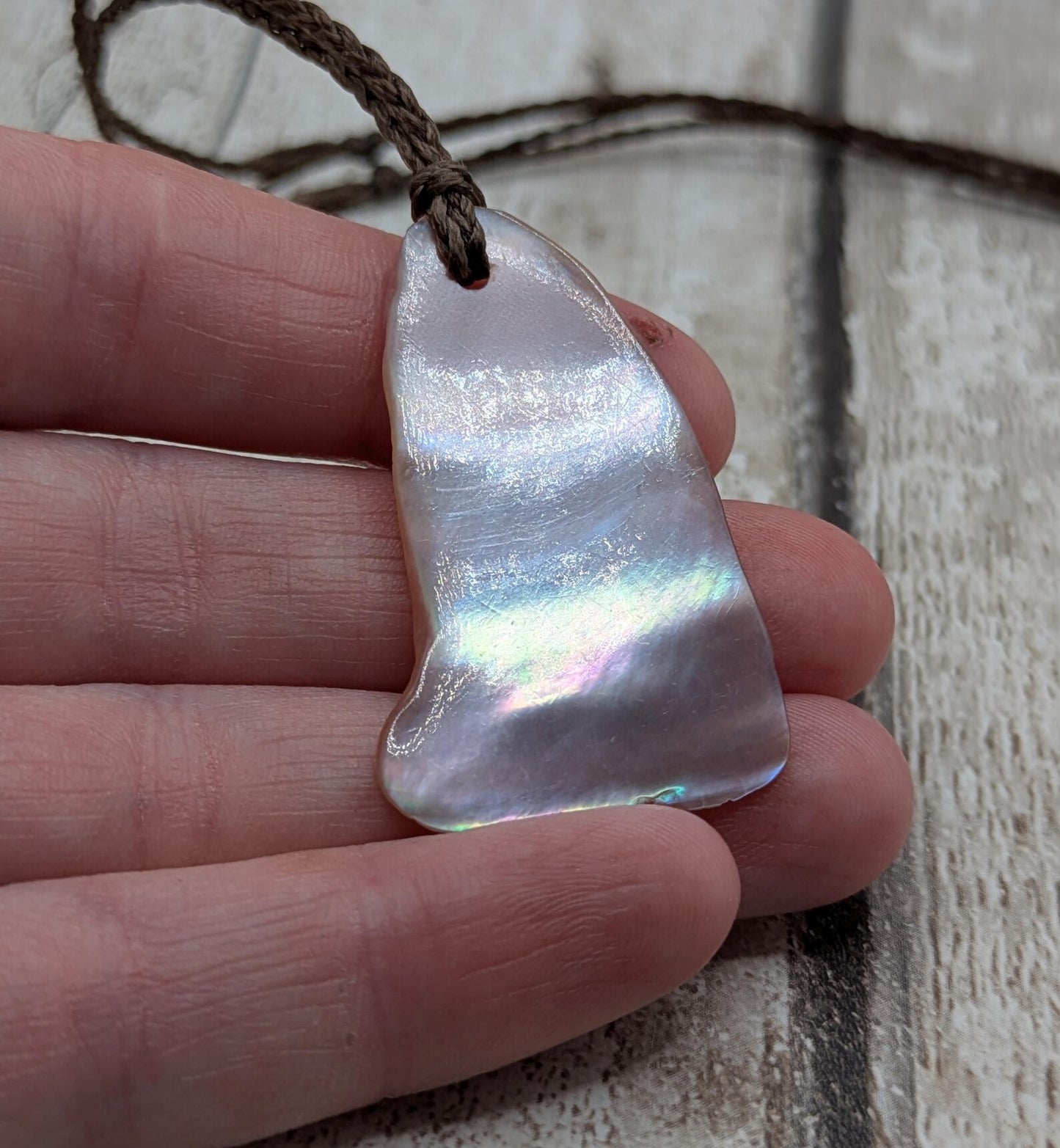 Pink freshwater mussel shell tumbled pendant.