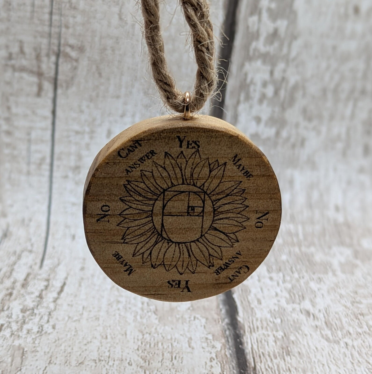 Tulip wood mini pocket pendulum board with sunflower design.