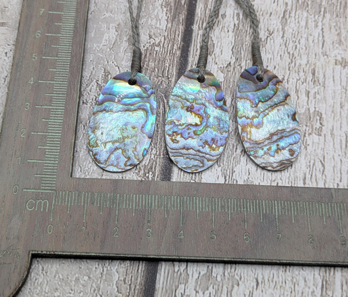 New Zealand rainbow paua abalone shell tumbled offcut unisex pendant.