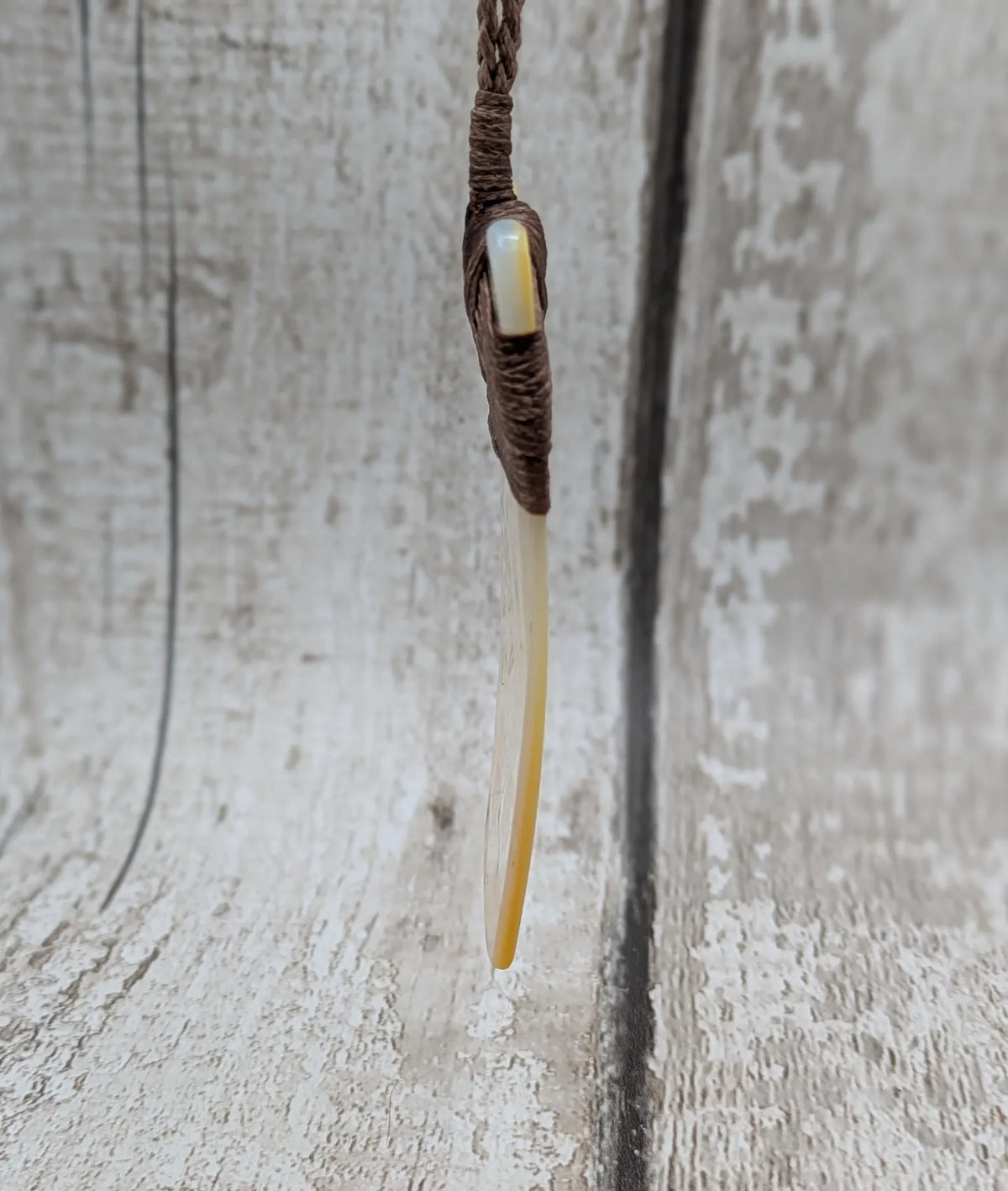 Mother of pearl hei toki adze pendant.