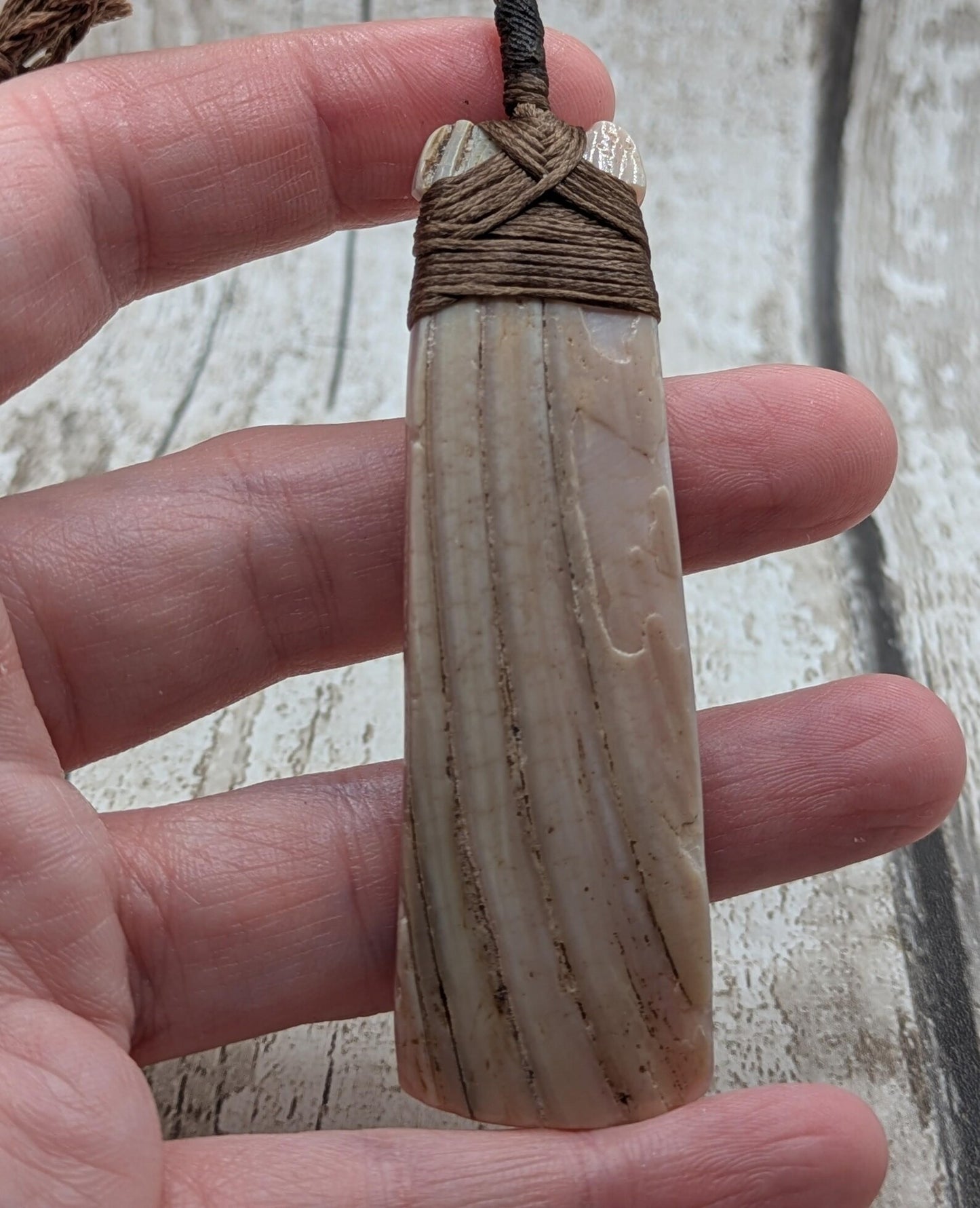 New Zealand freshwater pink mussel shell Hei Toki adze pendant.
