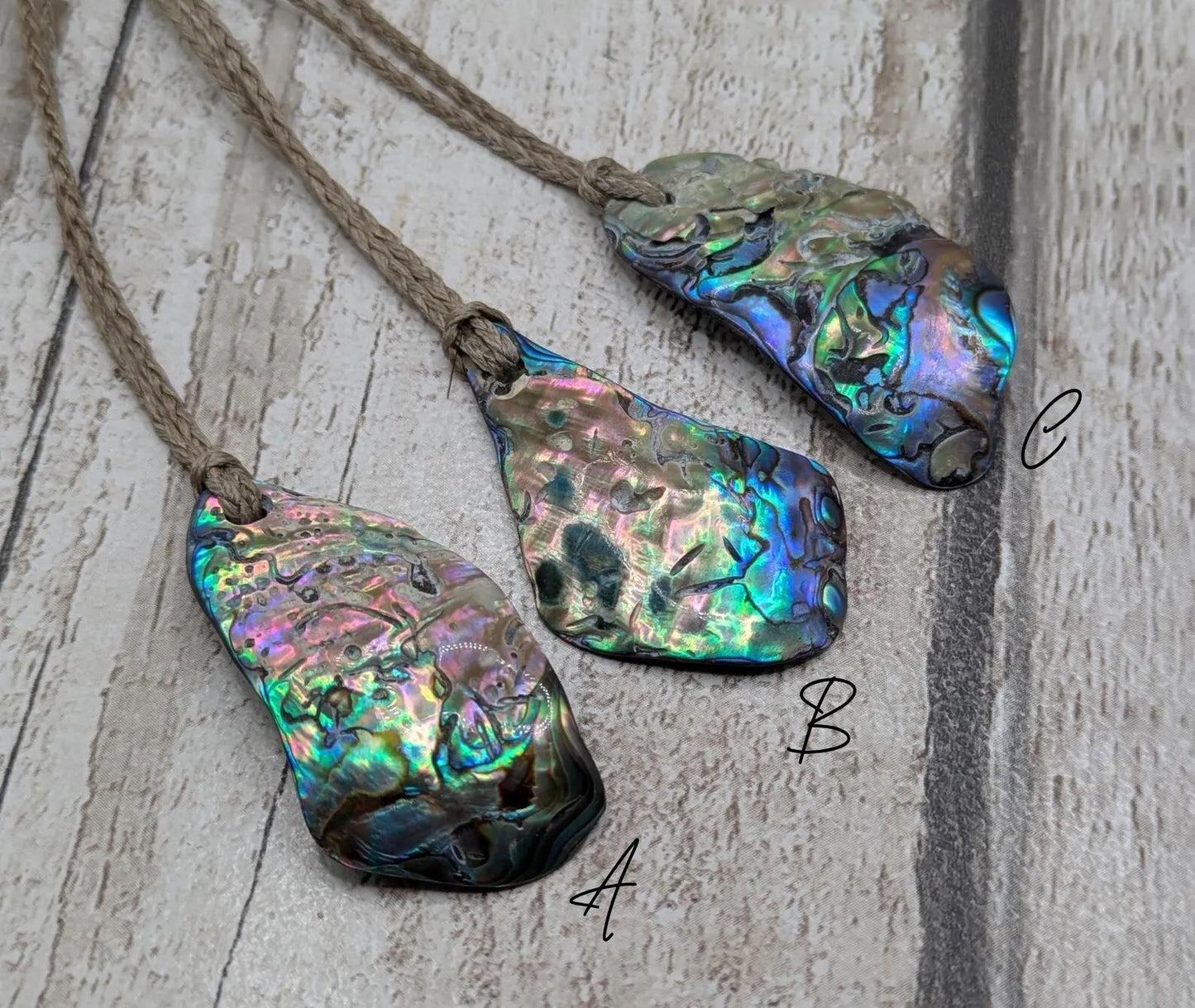 New Zealand free form wild tumbled rainbow Pāua pendant.