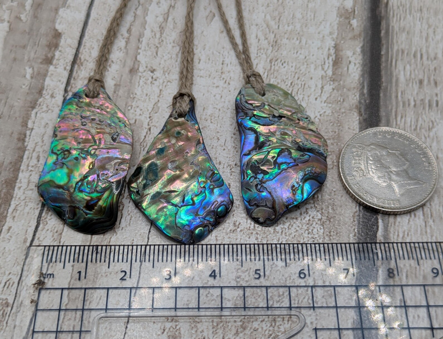 New Zealand free form wild tumbled rainbow Pāua pendant.