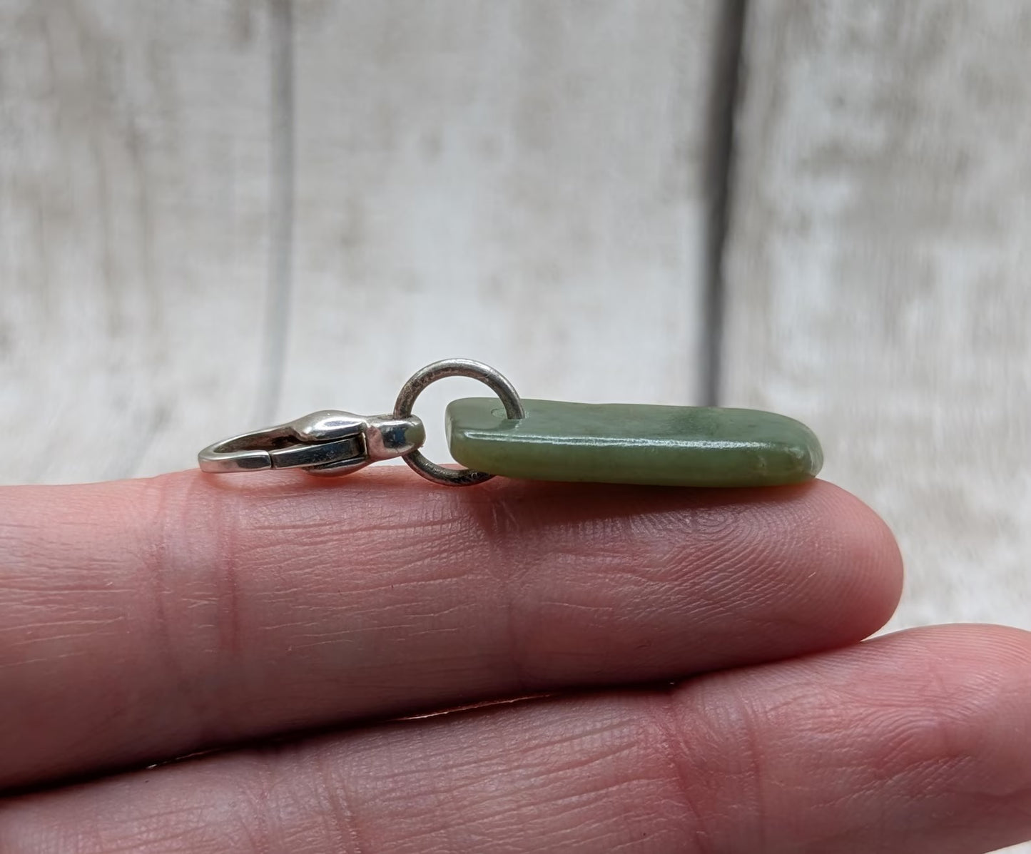 Tumbled New Zealand Pounamu greenstone jade clip on jewellery charm.