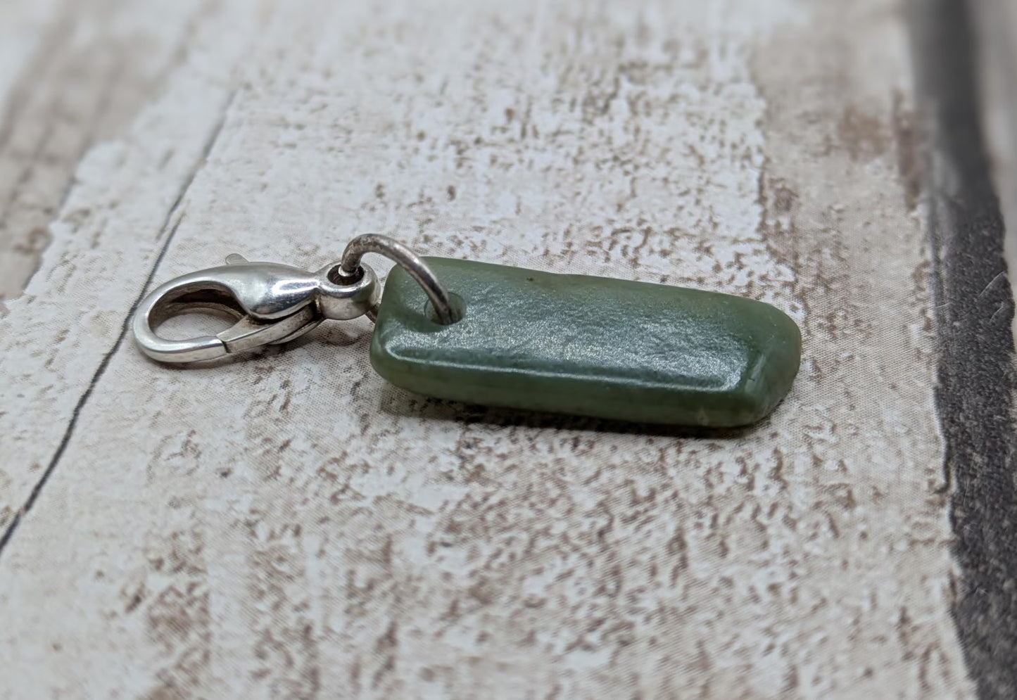 Tumbled New Zealand Pounamu greenstone jade clip on jewellery charm.