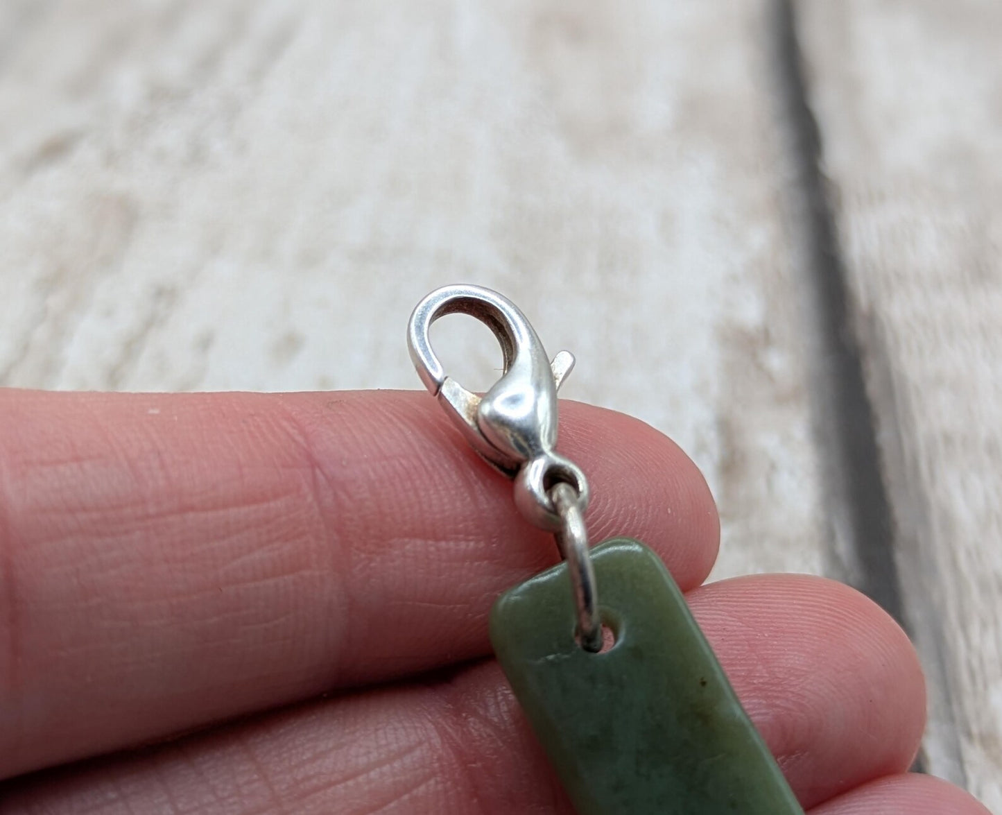 Tumbled New Zealand Pounamu greenstone jade clip on jewellery charm.