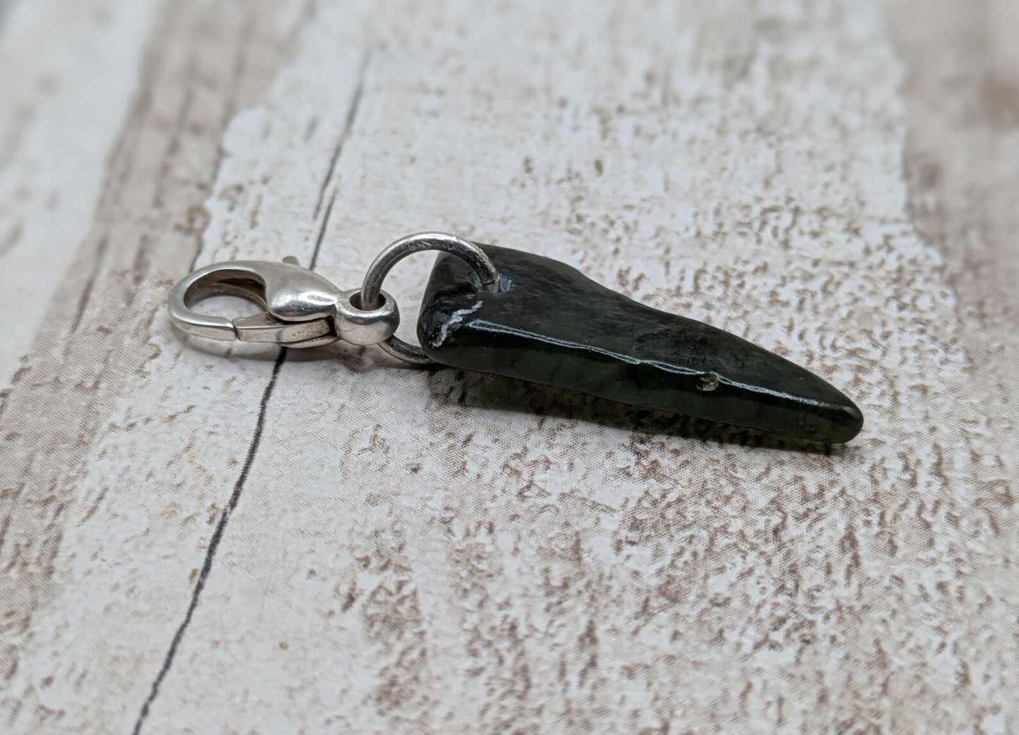 Tumbled New Zealand Pounamu greenstone jade clip on charm.