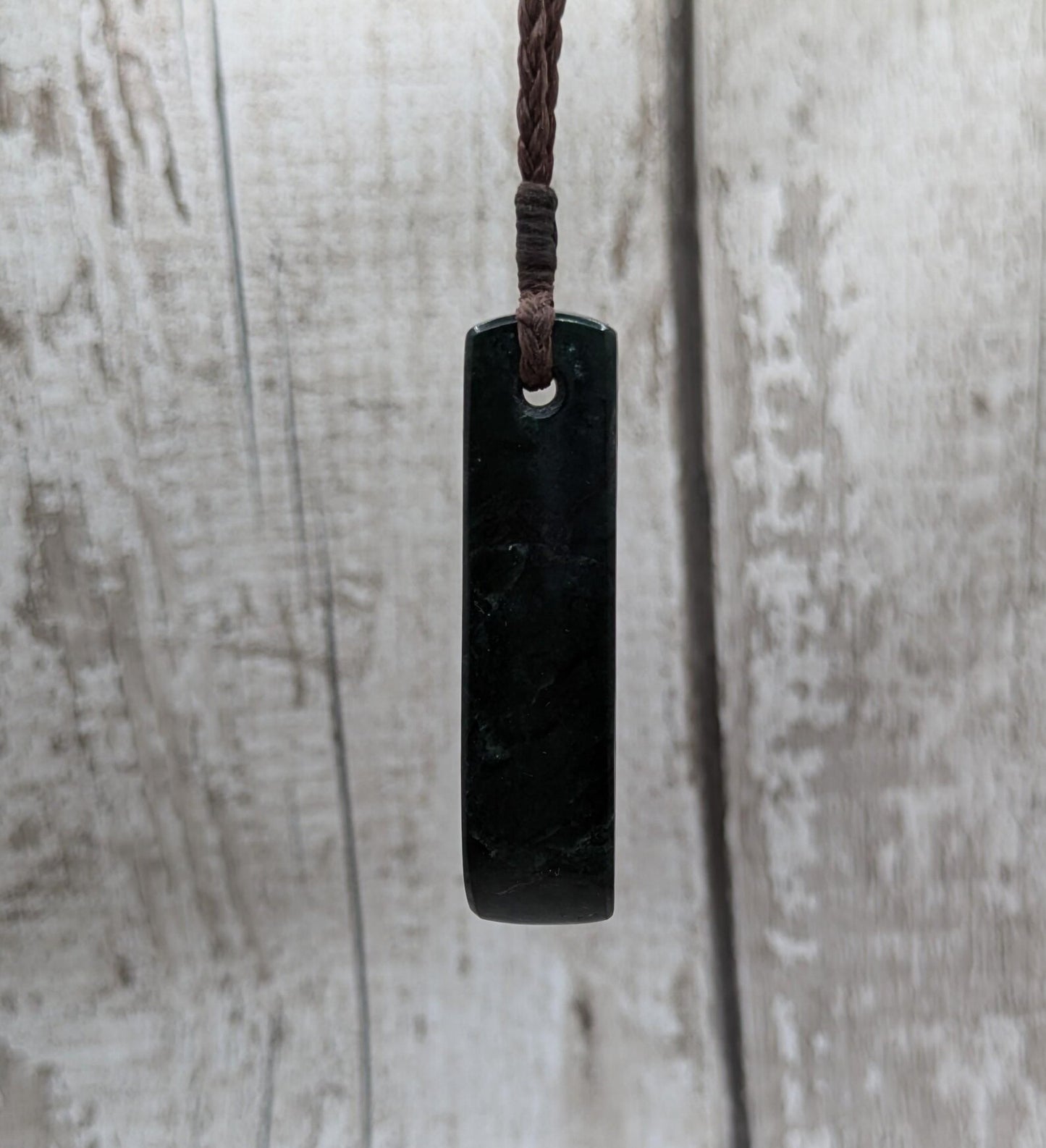 New Zealand serpentine Pounamu with Pāua shell inlay.