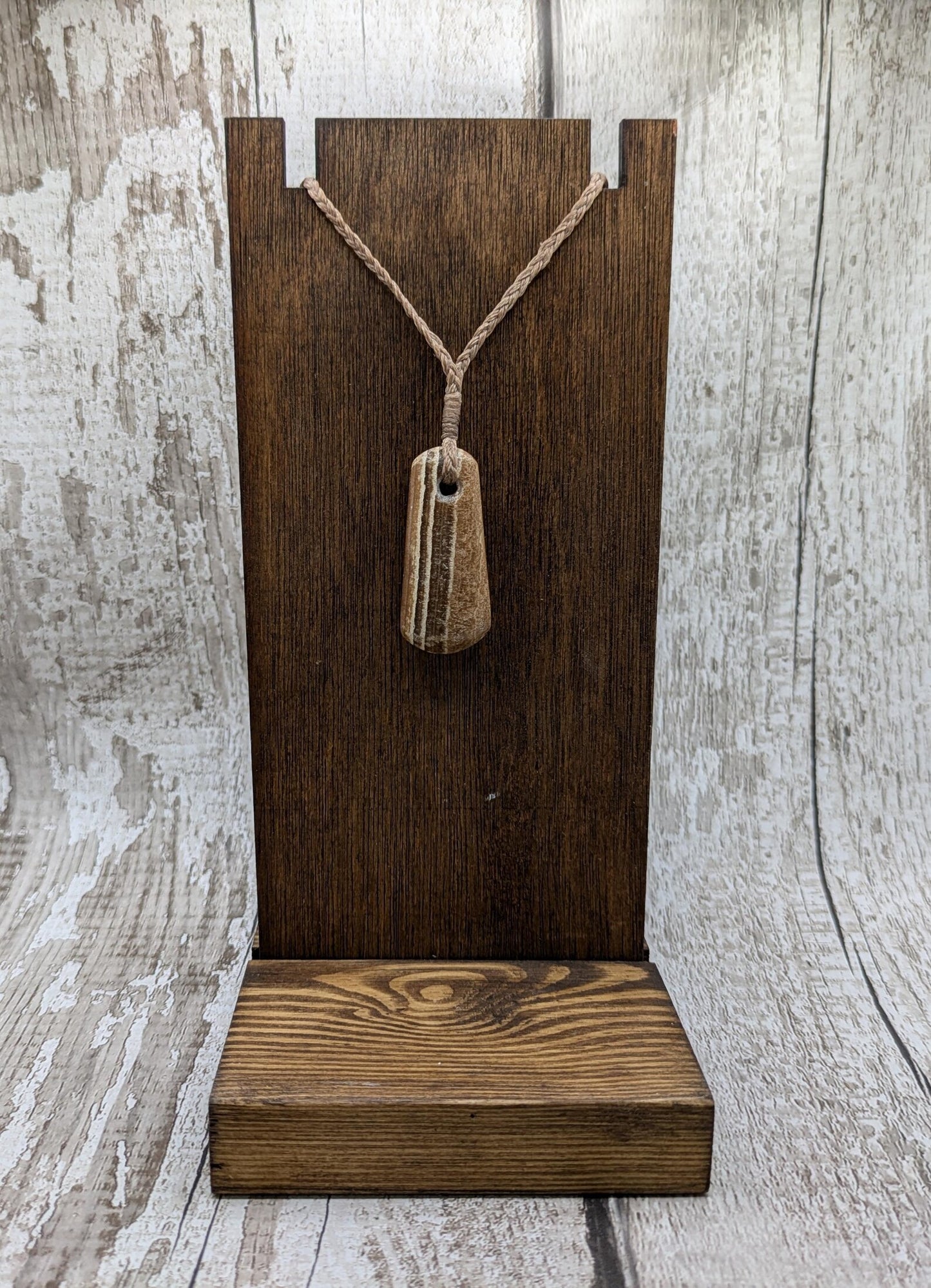 Striped argonite roimata teardrop pendant.
