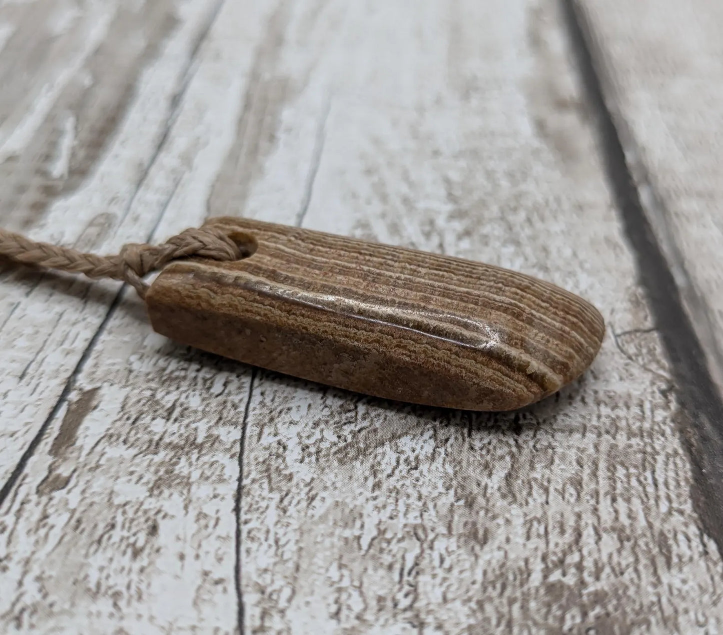 Striped argonite Toki styled pendant.