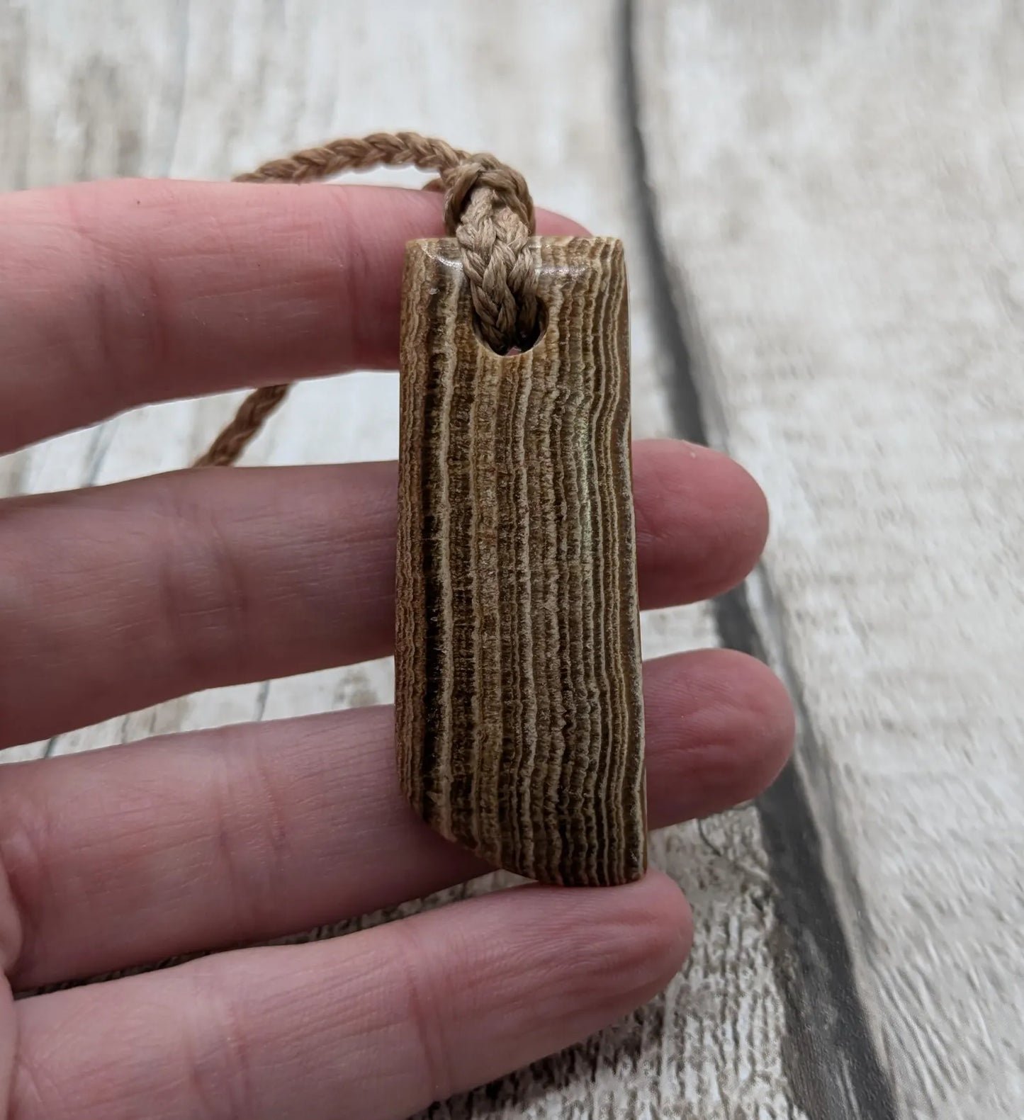 Striped argonite Toki styled pendant.