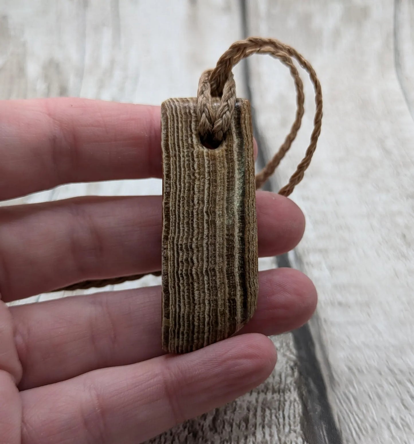 Striped argonite Toki styled pendant.