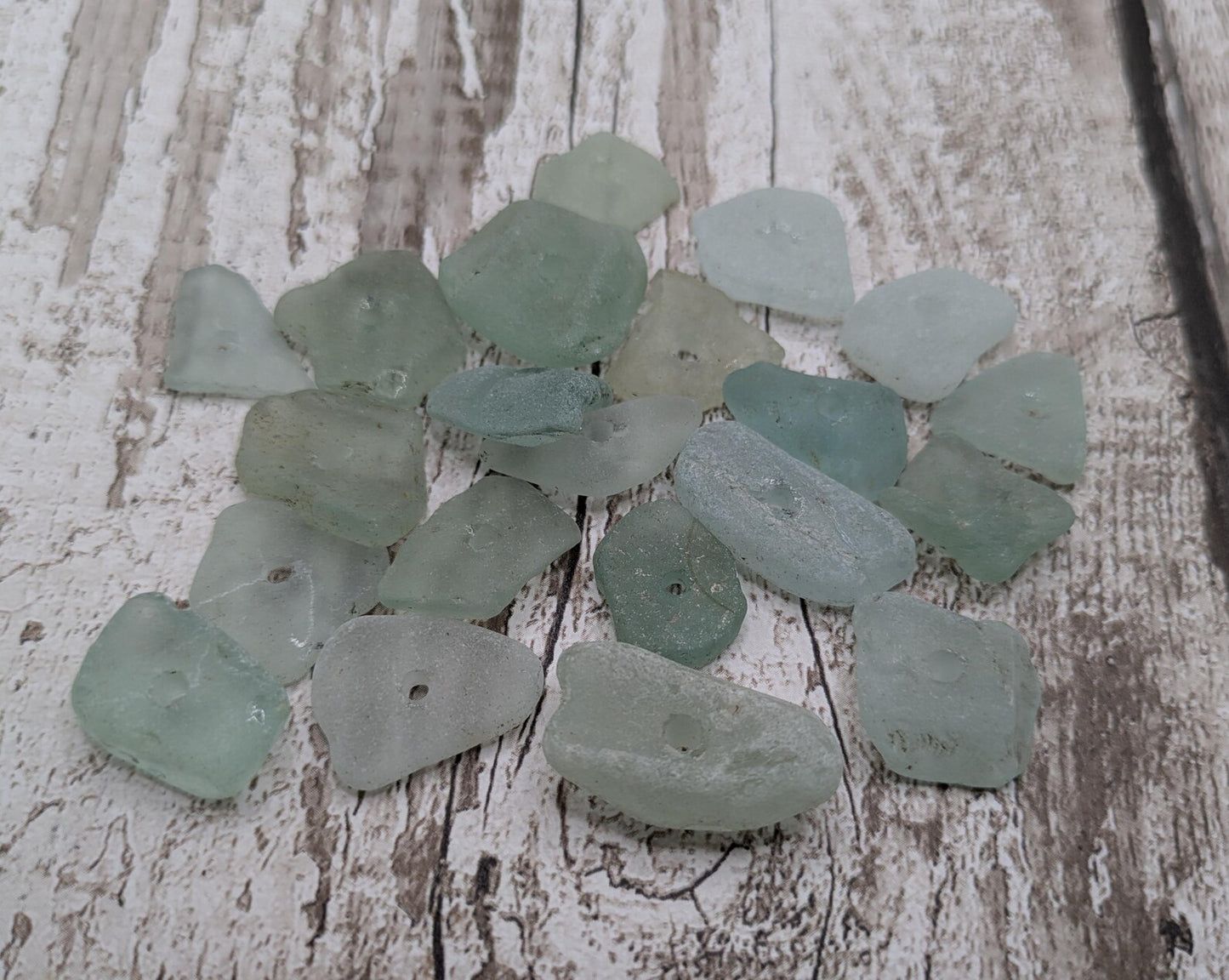 Teal sea glass central drilled beads.