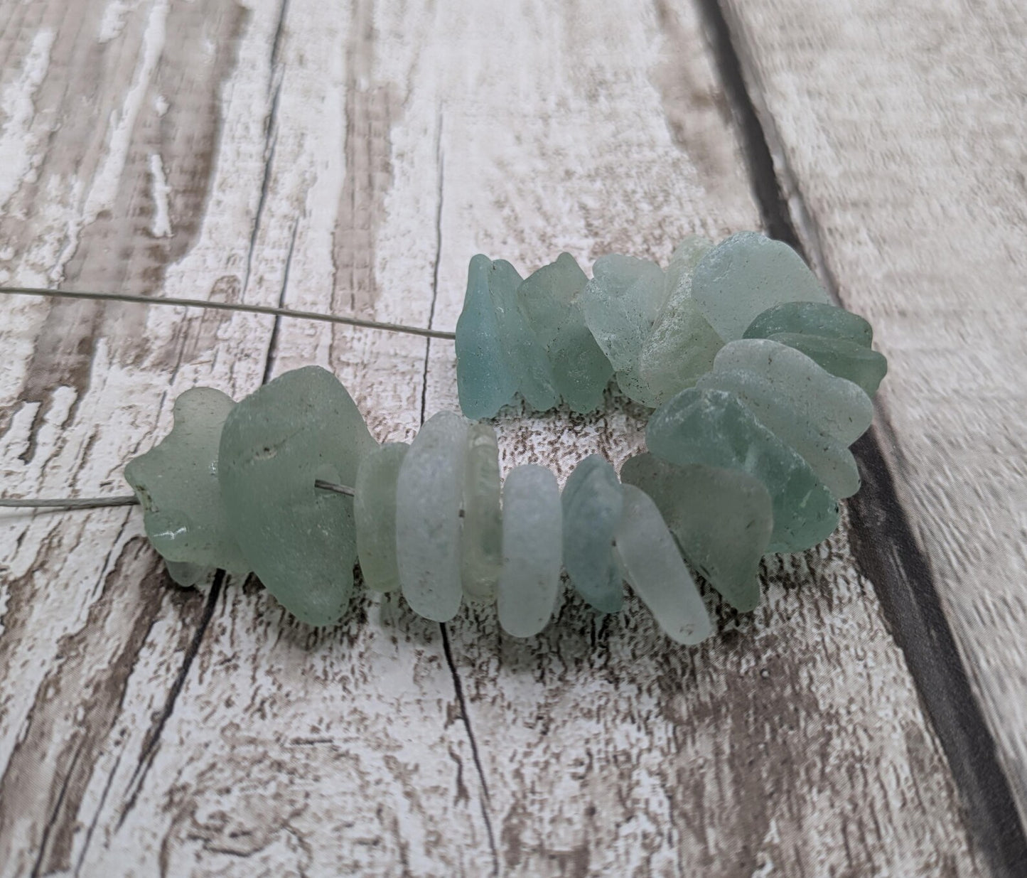 Teal sea glass central drilled beads.