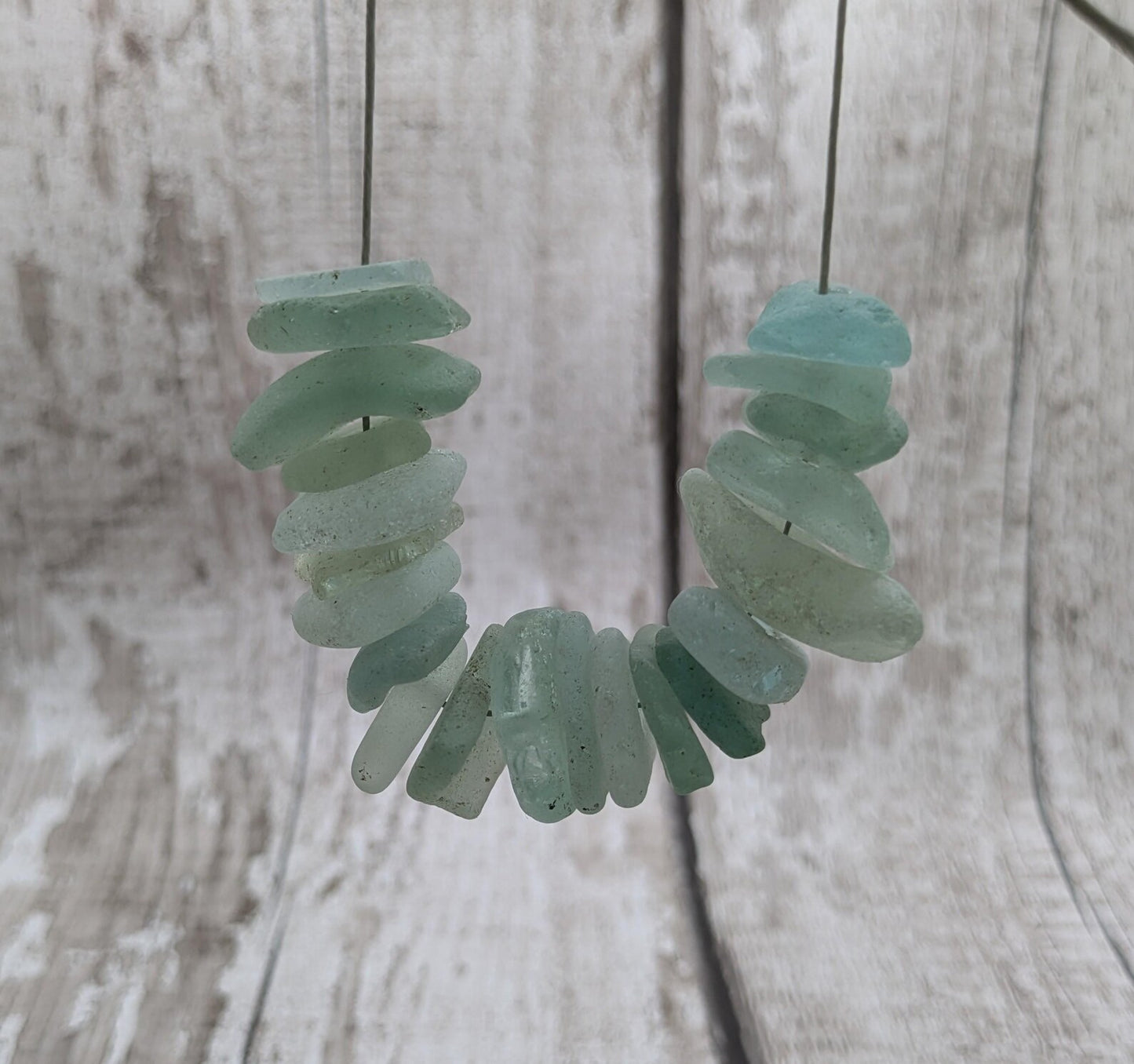 Teal sea glass central drilled beads.