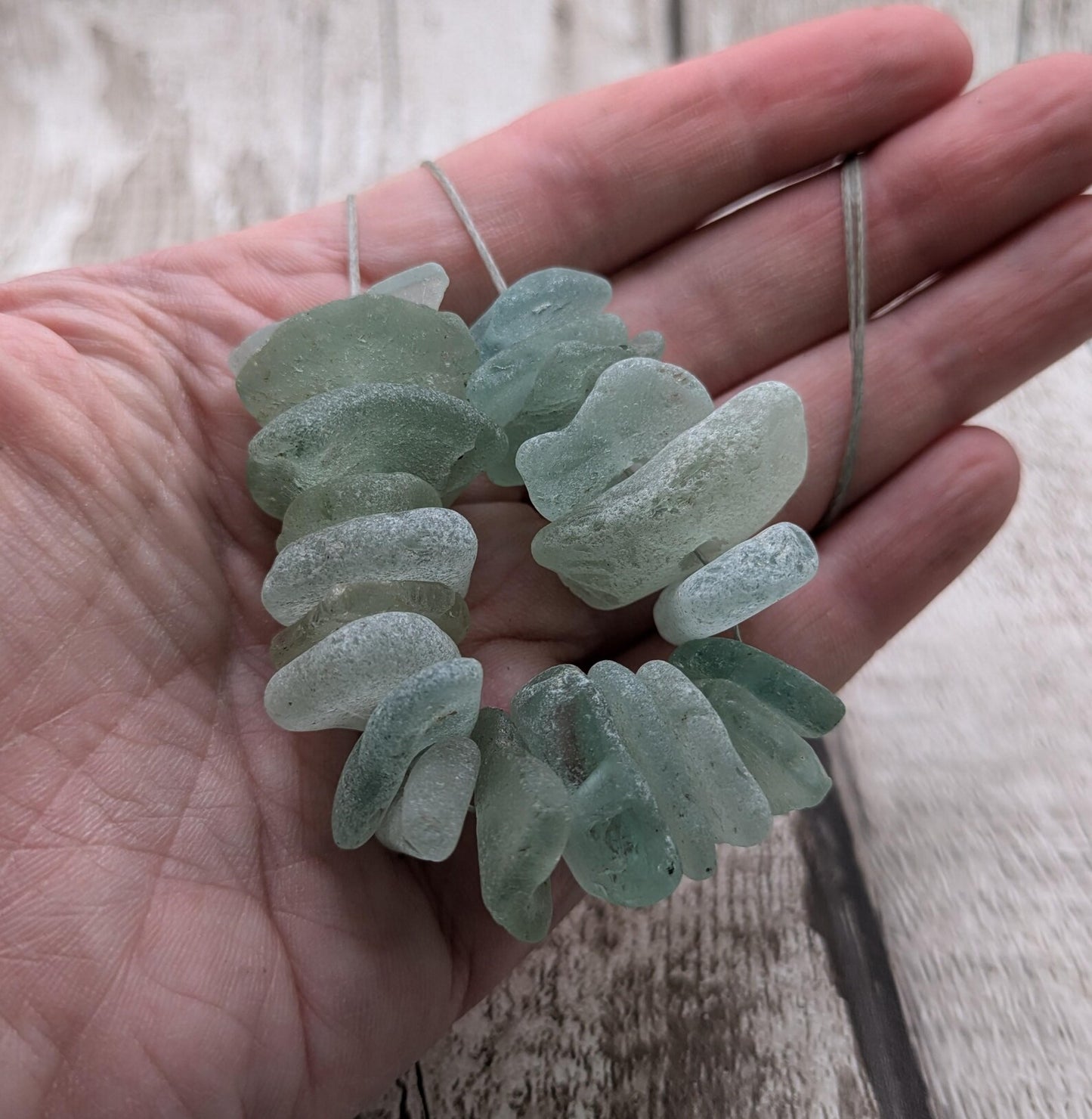 Teal sea glass central drilled beads.