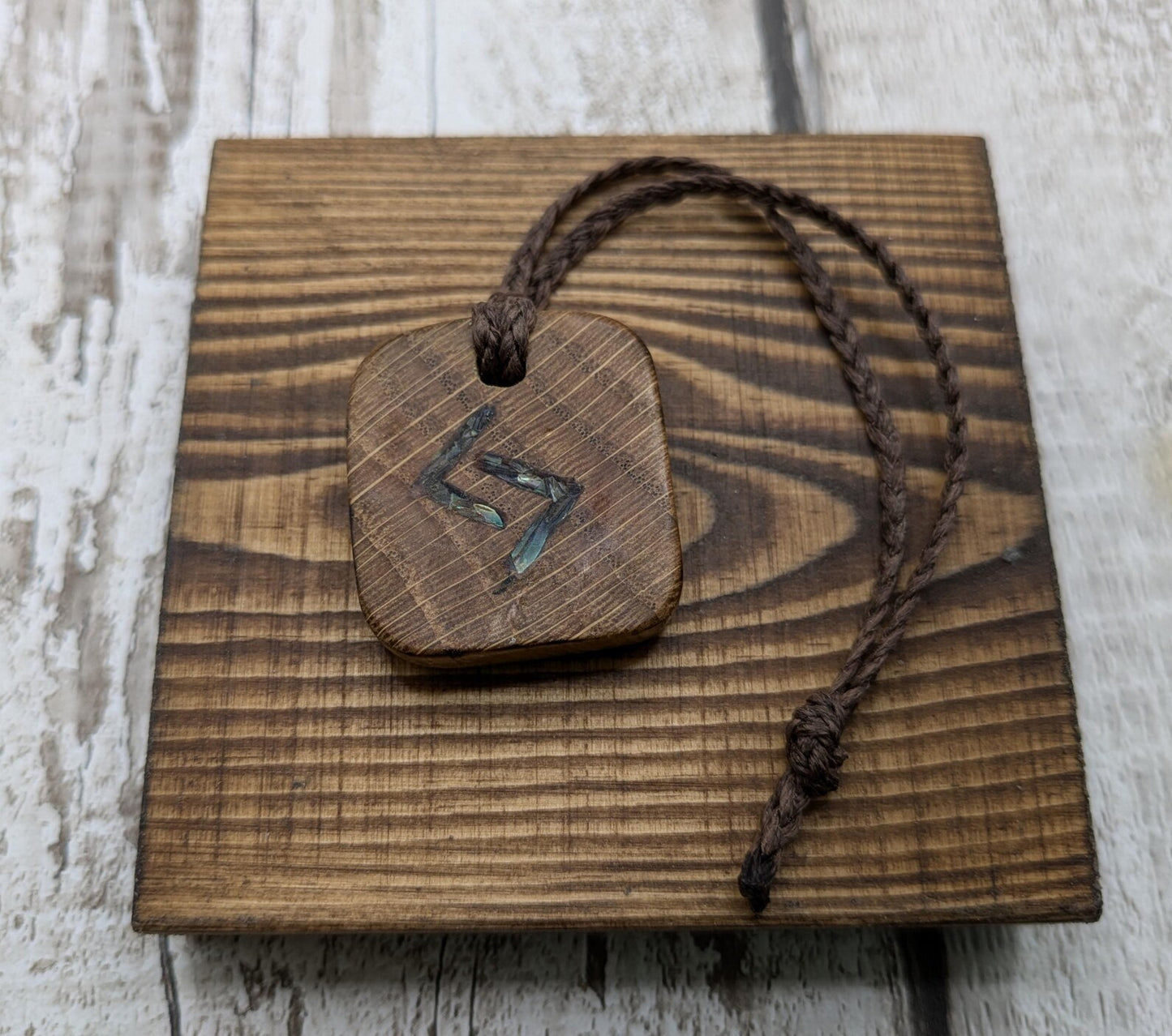Oak wood jera Viking rune Christmas decoration with Pāua shell.