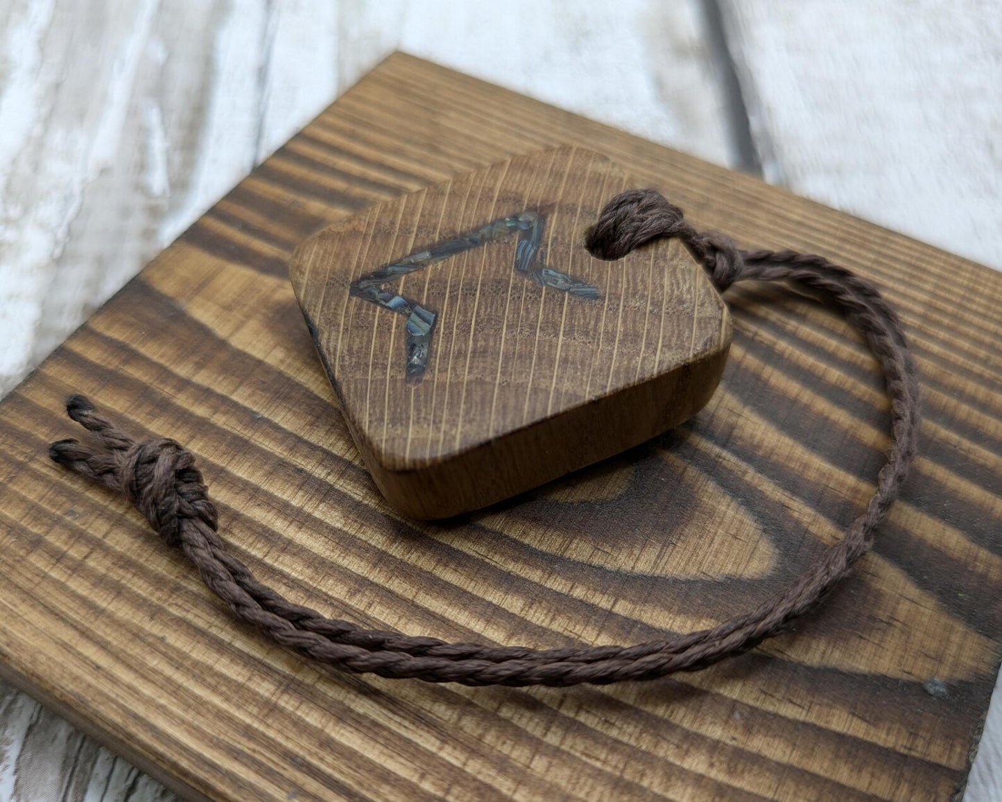 Perthro oak wood rune Christmas decoration with Pāua shell inlay.